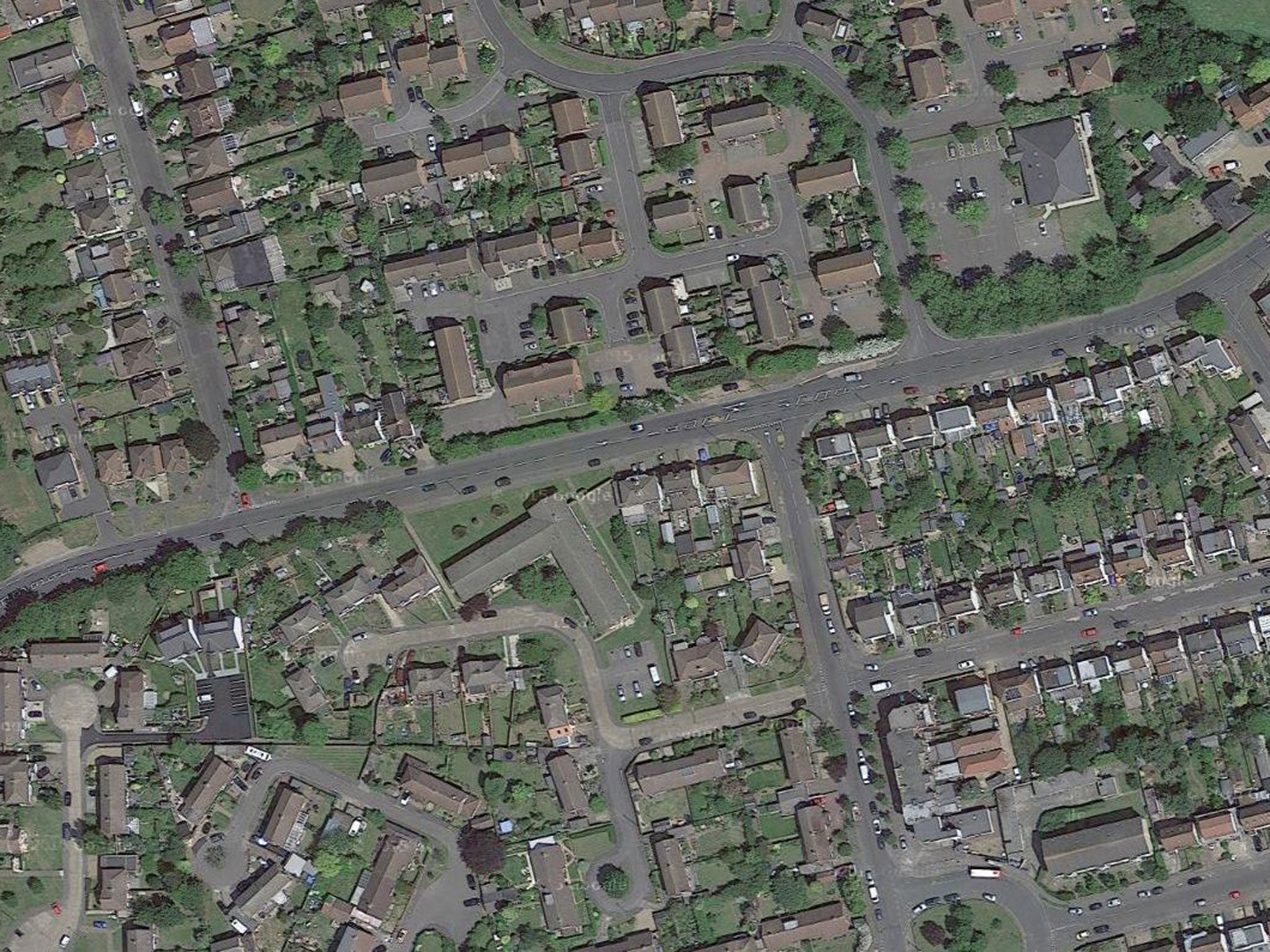 Police officers discovered the body of the woman at a residential address in Walton Road, West Molesey