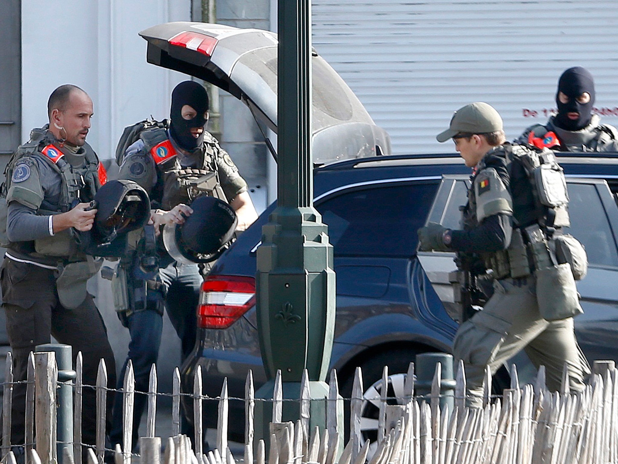 Police at the scene where shots were fired during a police search of a house in the suburb of Forest near Brussels, Belgium