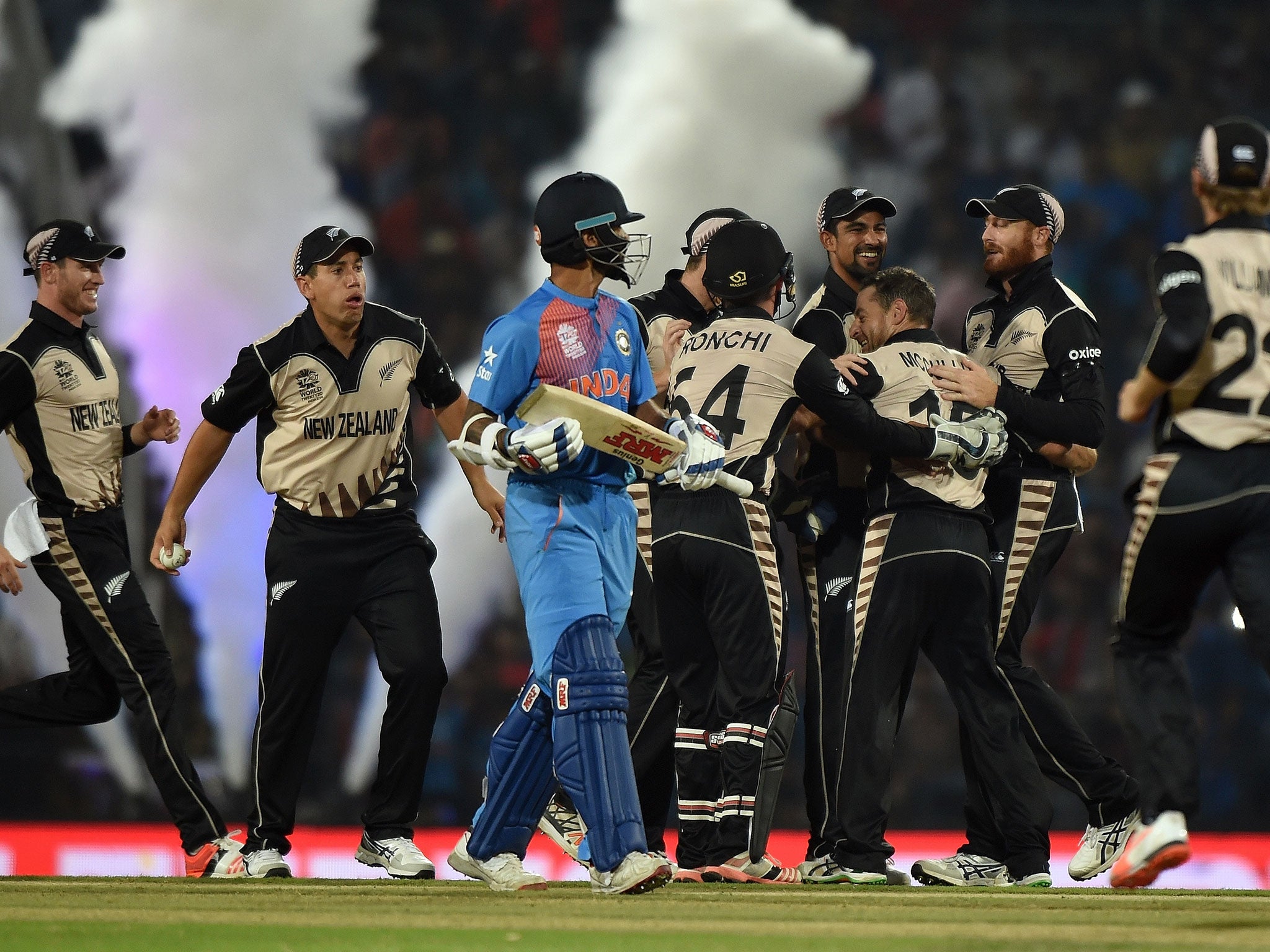 New Zealand players celebrate after the wicket of India's batsman Shikhar Dhawan