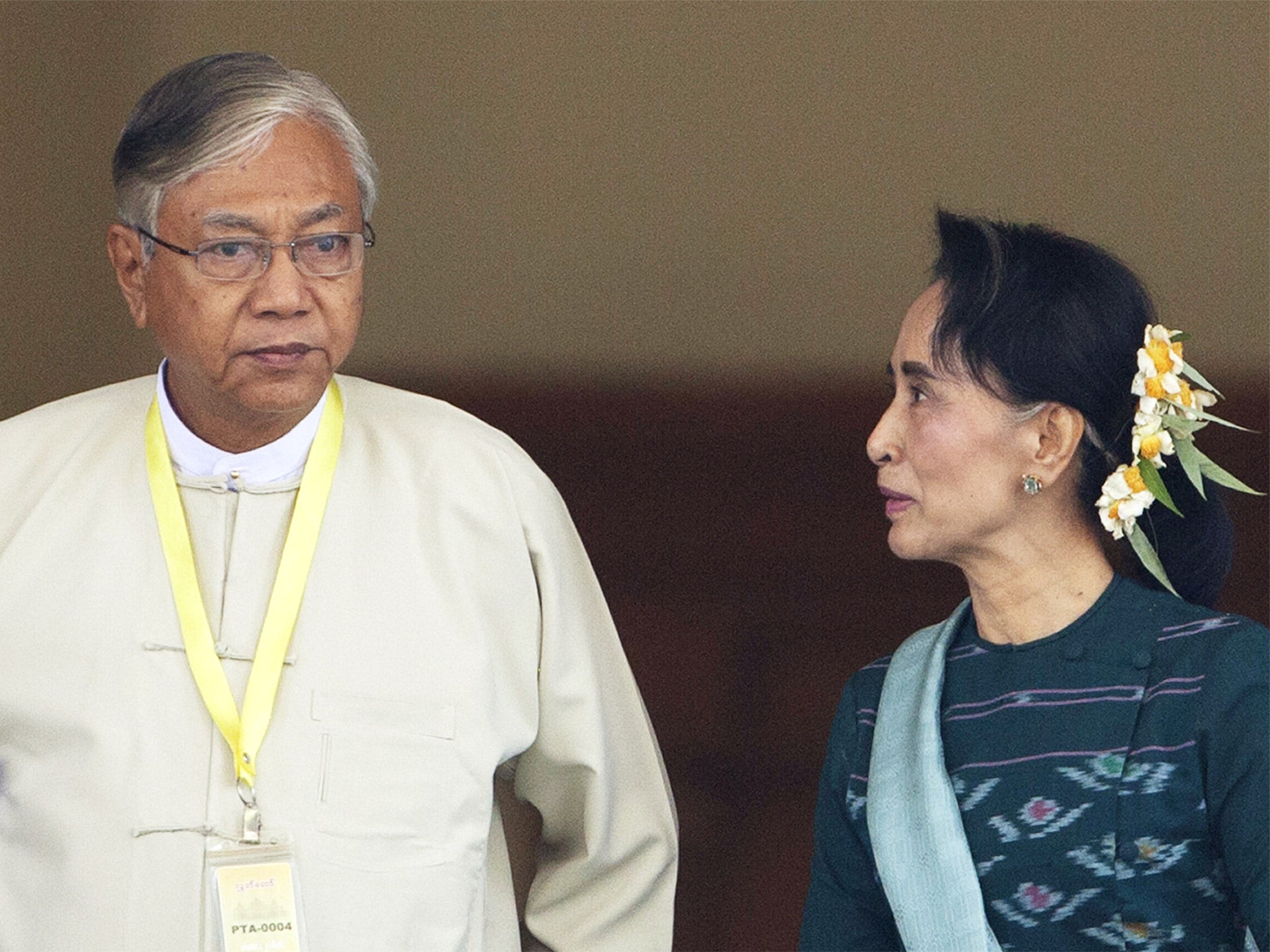 Htin Kyaw, left, newly elected president of Burma, walks with National League for Democracy leader Aung San Suu Kyi, in Naypyitaw