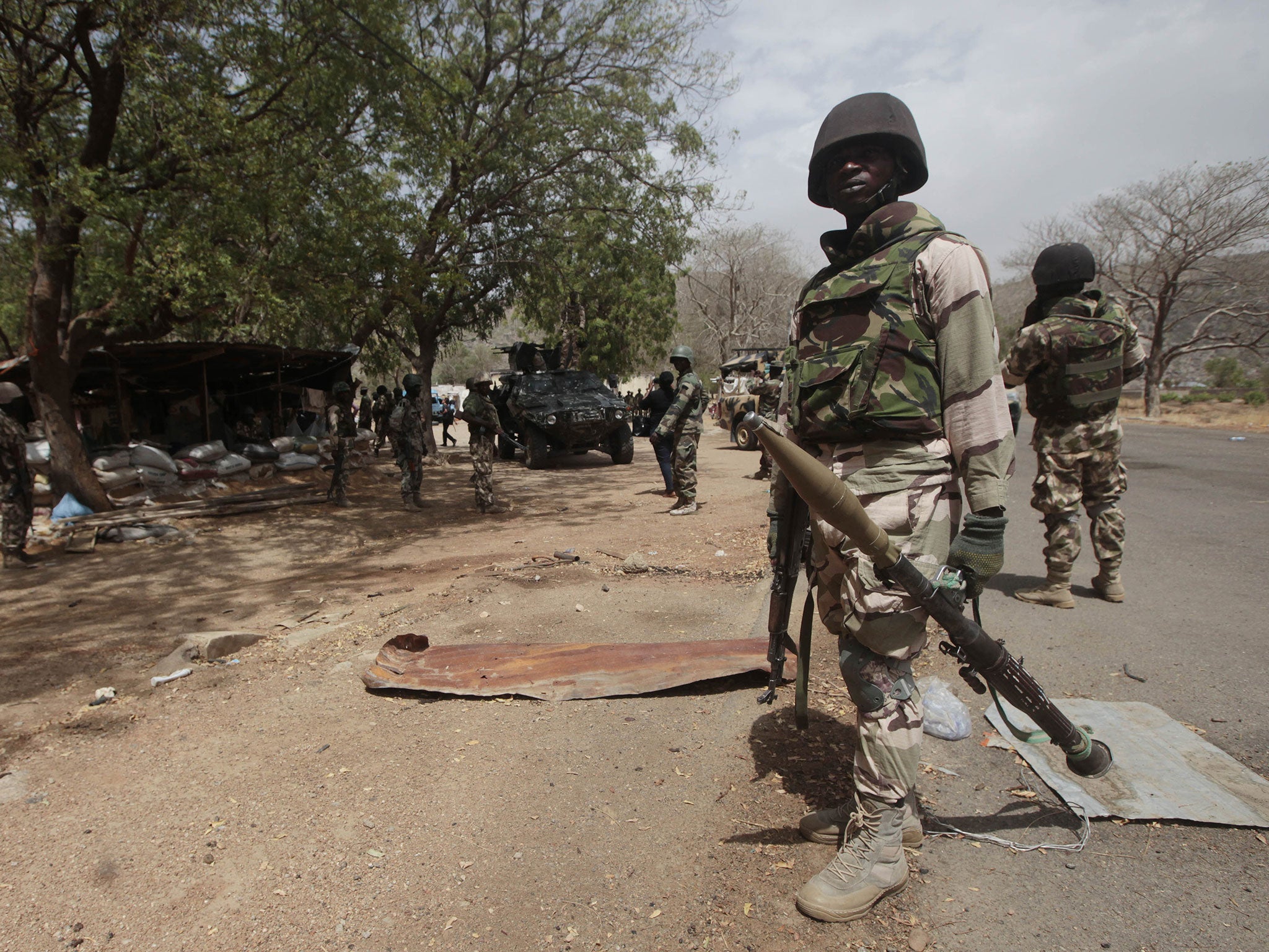 Nigerian soldiers man a checkpoint in Gwoza, Nigeria, a town newly liberated from Boko Haram in April 2015