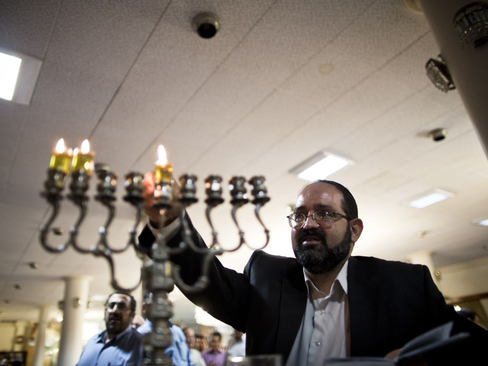 Praying away: Rabbi Younes Hamami Lalehzar at Abrishami synagogue in Tehran, where there are six such places of worship