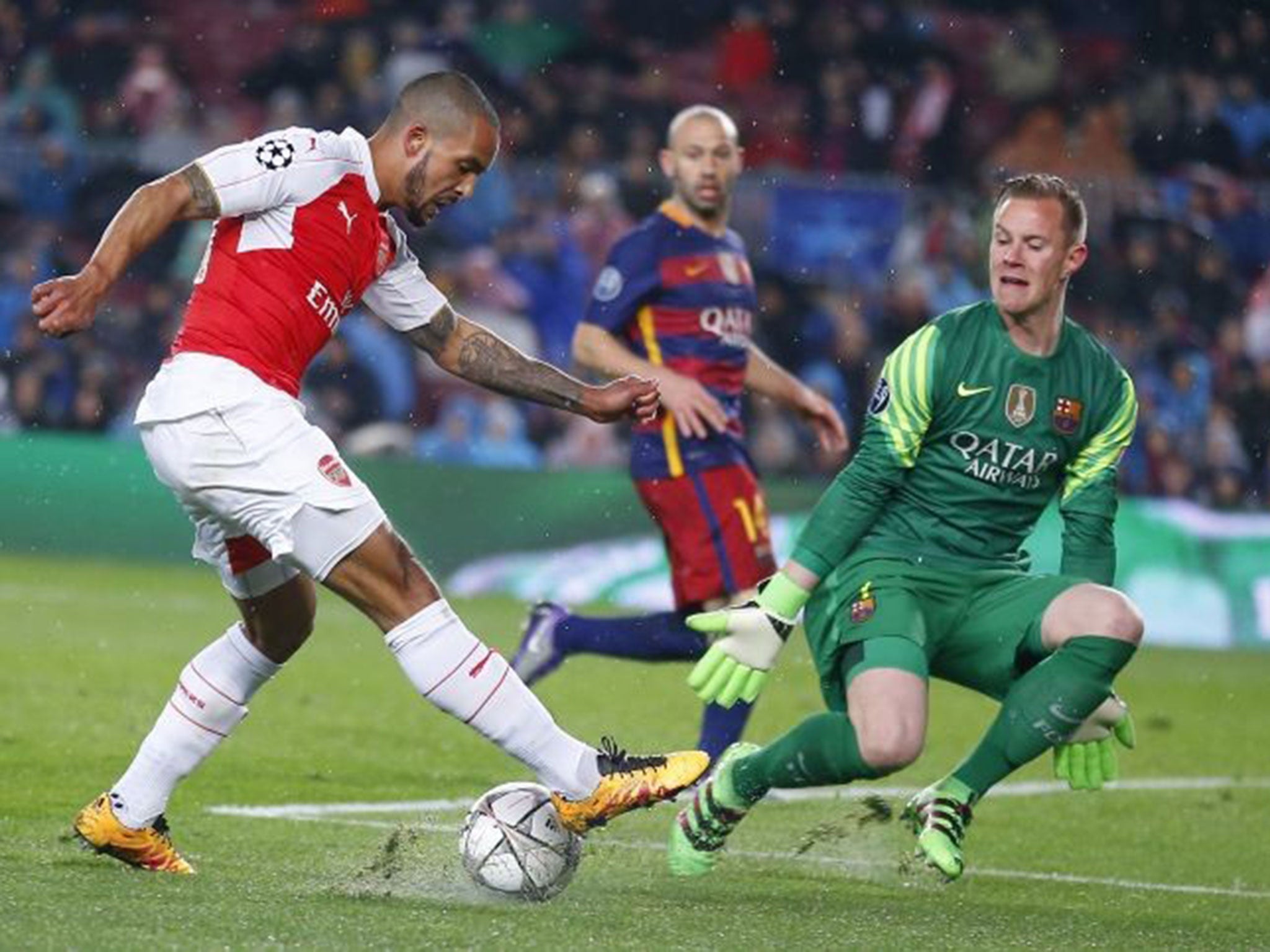 Barcelona goalkeeper Marc-Andre ter Stegen saves an effort from Theo Walcott