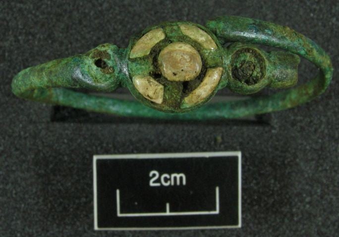 A 2,500-year-old bronze bracelet with coral decoration which was found at the site (Pic: MAP Archaeological Practice/PA)