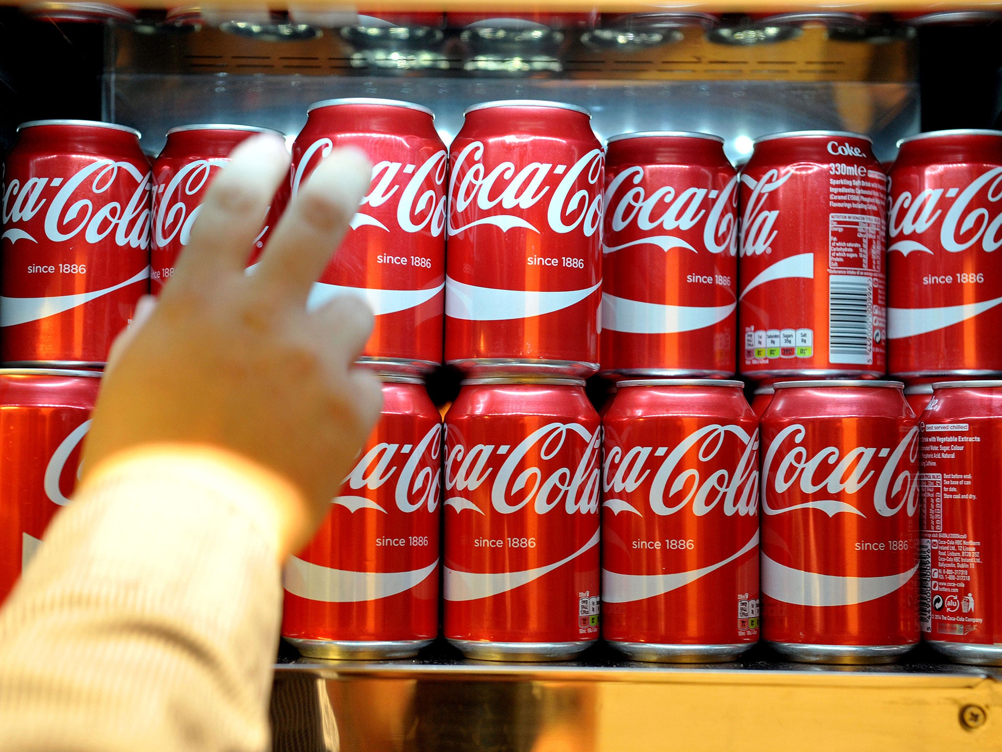 Cans of Coca-Cola would currently fall within the higher rate of the sugar tax