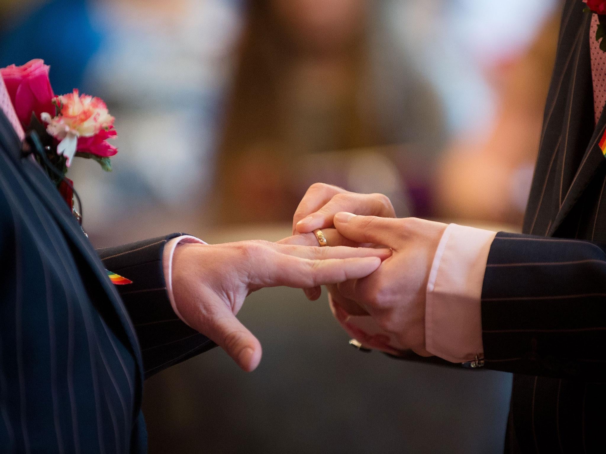 Rings are exchanged at a wedding ceremony in Brighton, March 2014, as same-sex marriage came into effect (AFP/Getty)