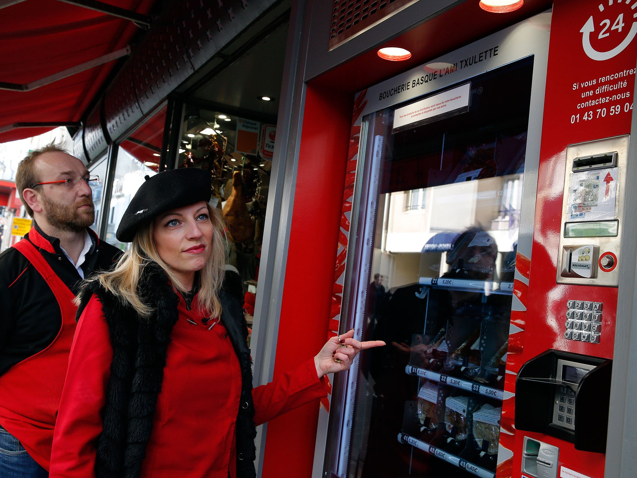 Florence, right, and Michel Pouzol show by the first meat vending machine installed in the French capital, in Paris, Tuesday, 15 March, 2016