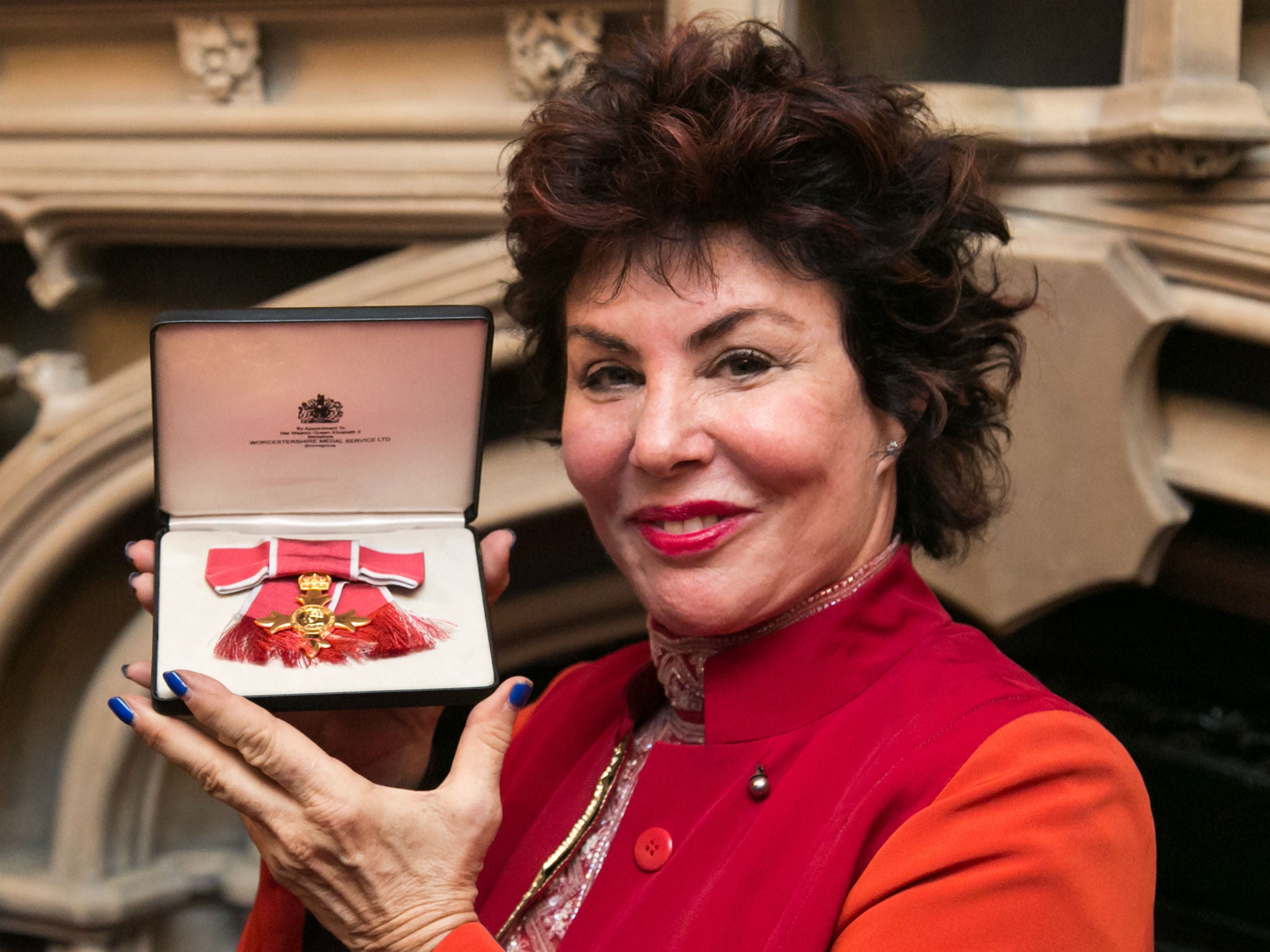 Ruby Wax with her honorary OBE Daniel Day