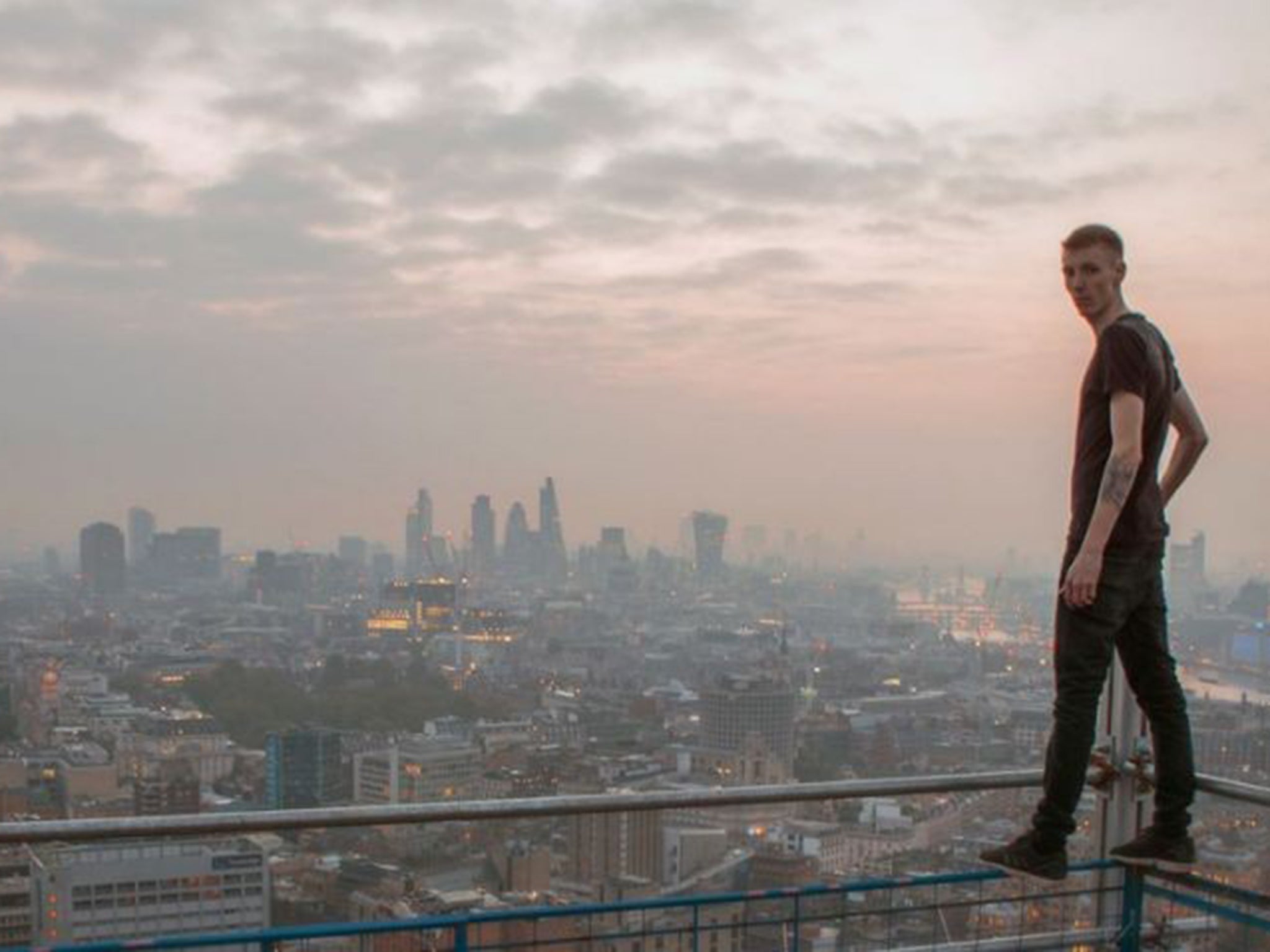 Urban explorer Matthew Adams surveys the landscape in London