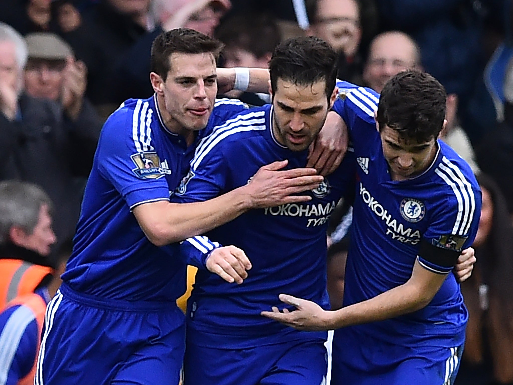 Cesar Azpilciueta, Cesc Fabregas and Oscar celebrate Chelsea's first goal