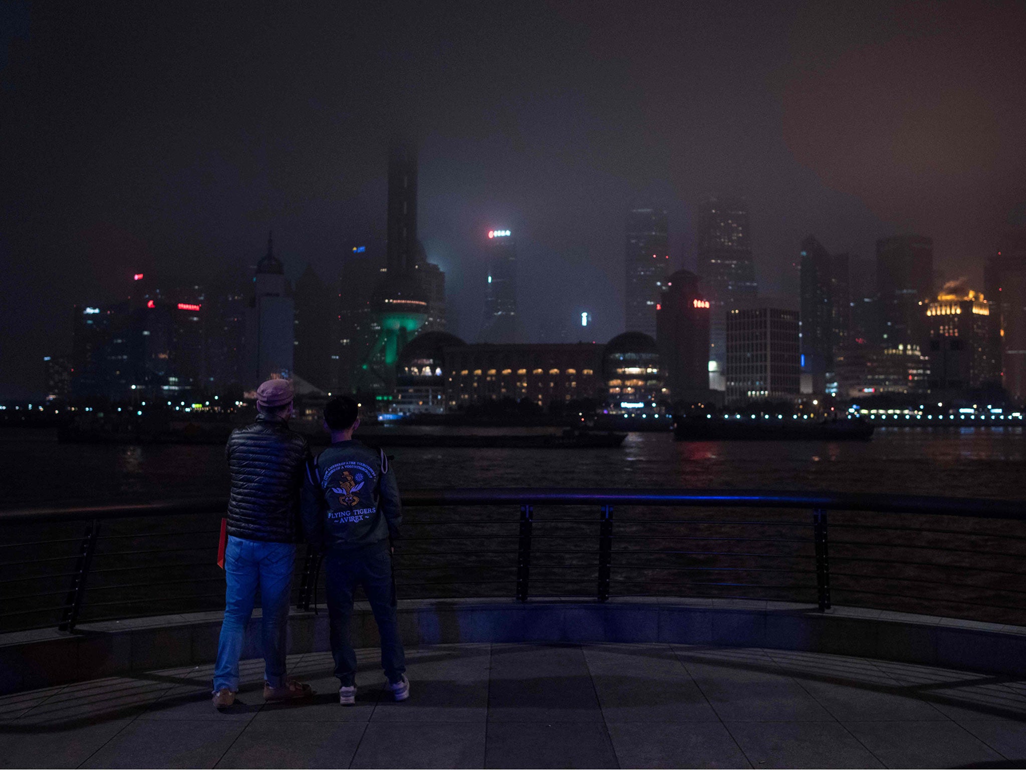 The Shanghai skyline descends into darkness during Earth Hour last year