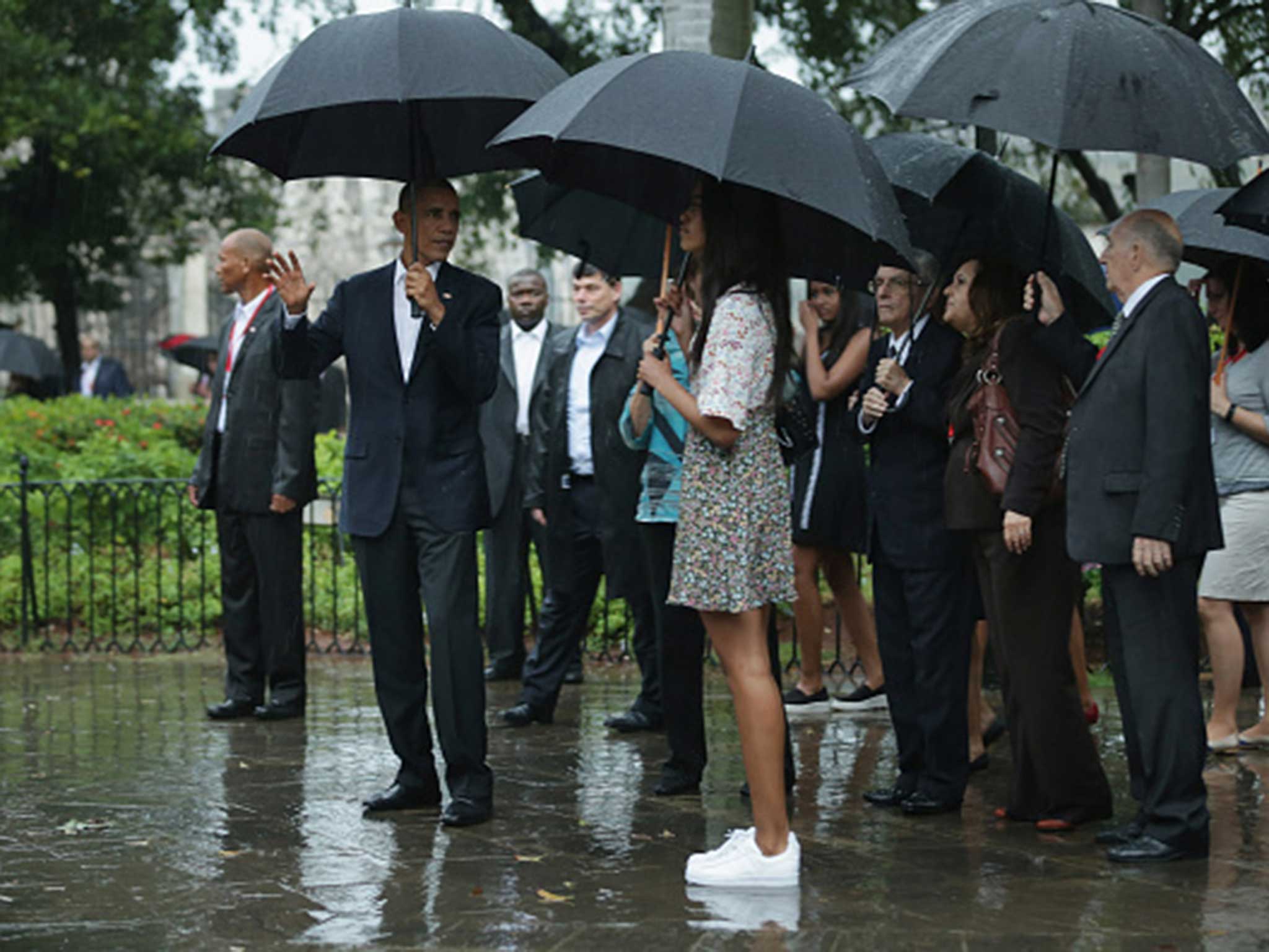 Obama and his entourage pause to view a statue of the Cuban independence hero Carlos Manuel de Cespedes