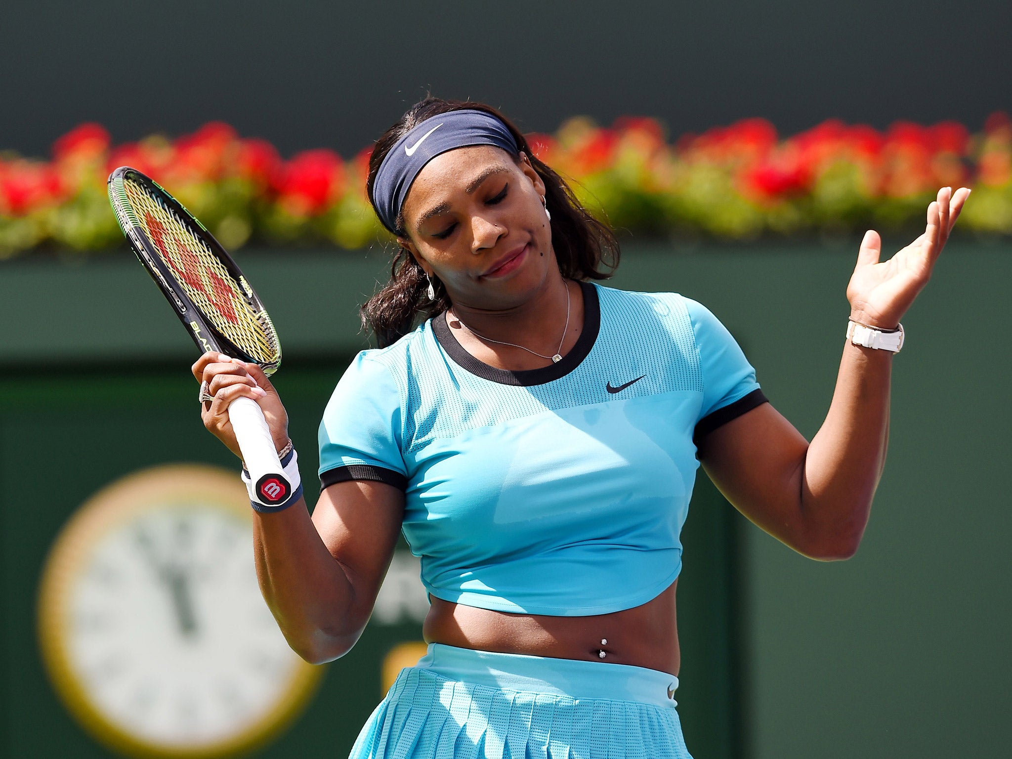 Serena Williams reacts after suffering defeat by Victoria Azarenka in the BNP Paribas Open final