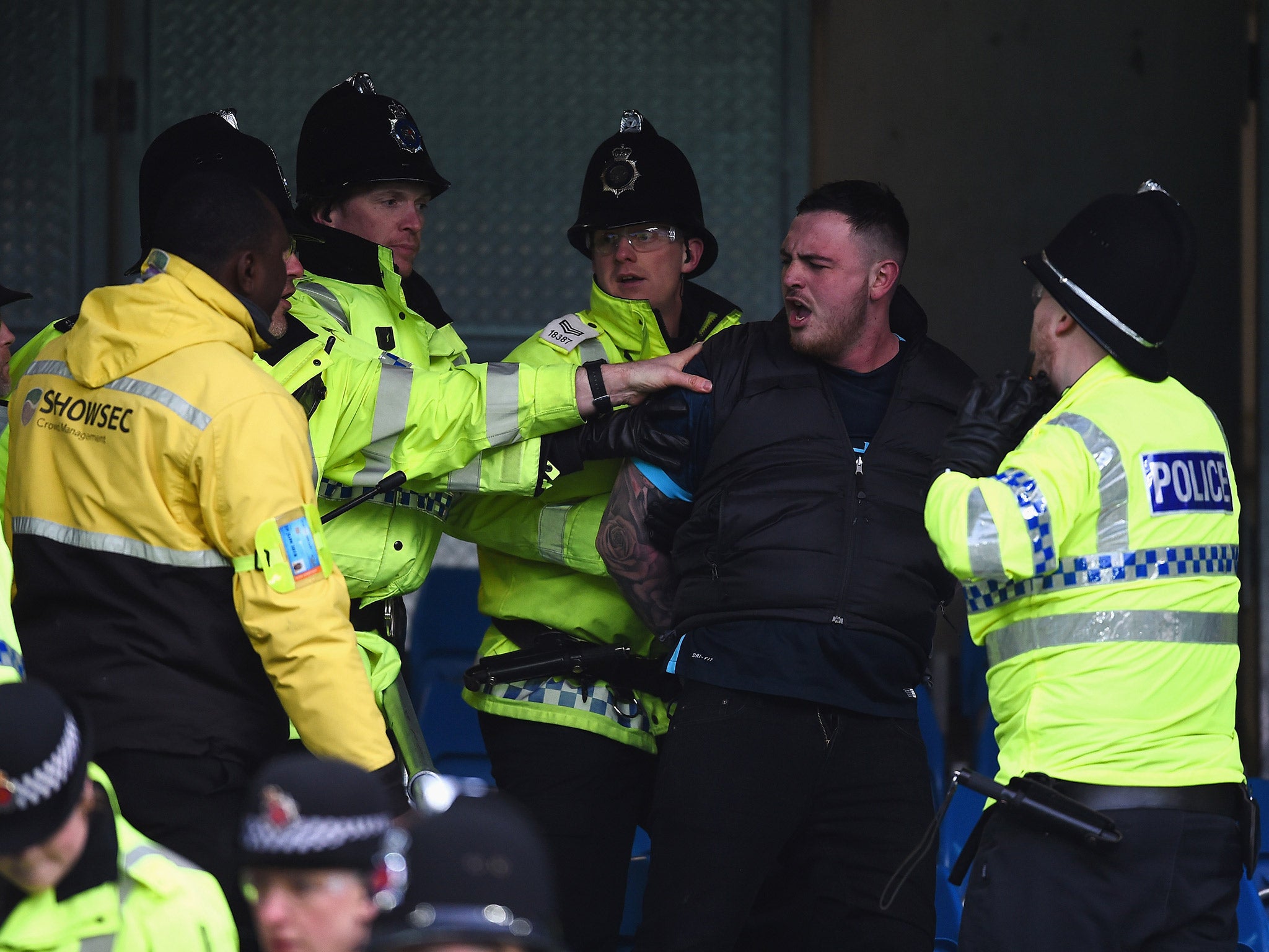 
One man is arrested by police during the Manchester derby 