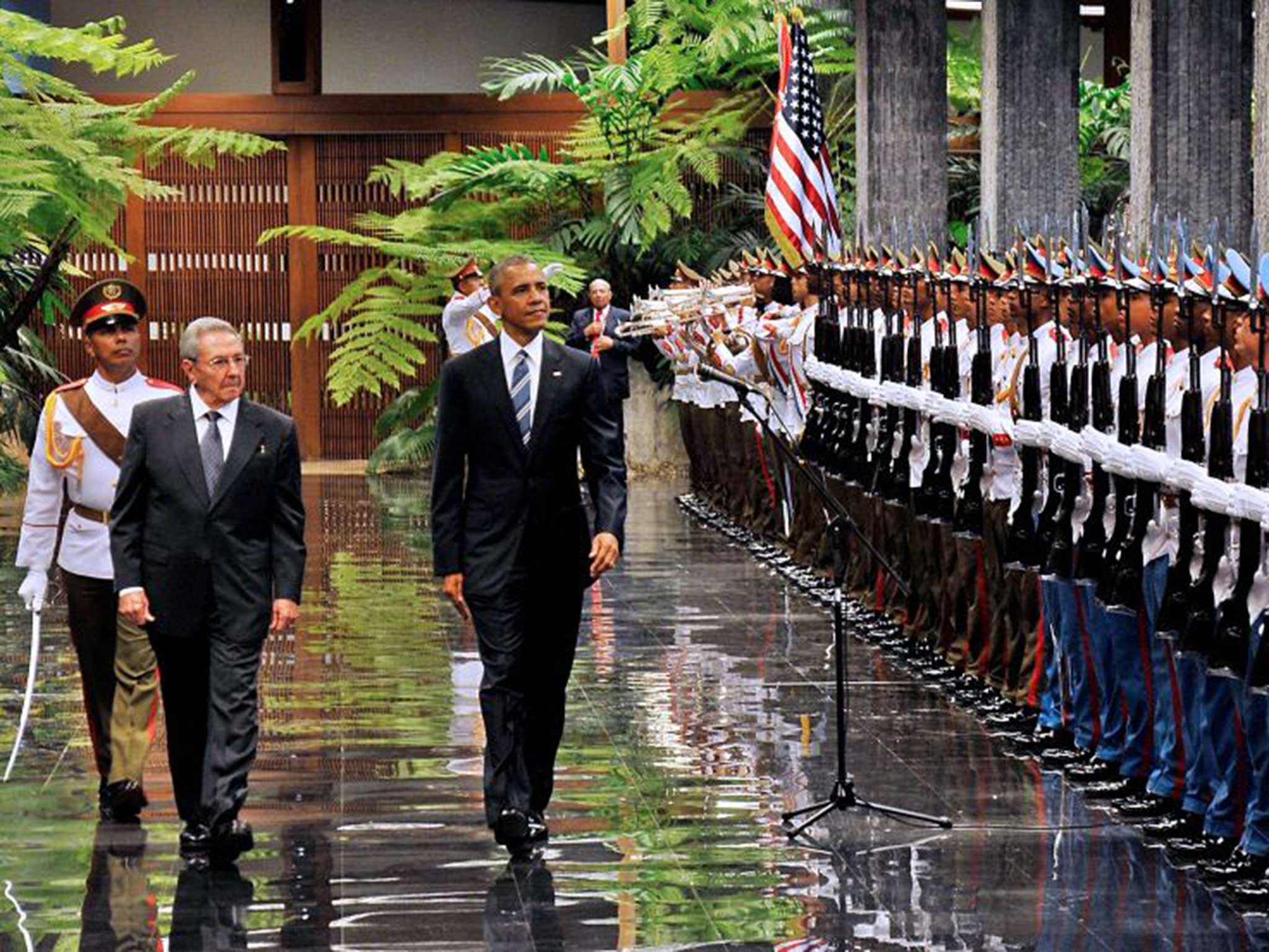 Cuban President Raul Castro and President Obama review the troops at the Revolution Palace in Havana on March 21, 2016