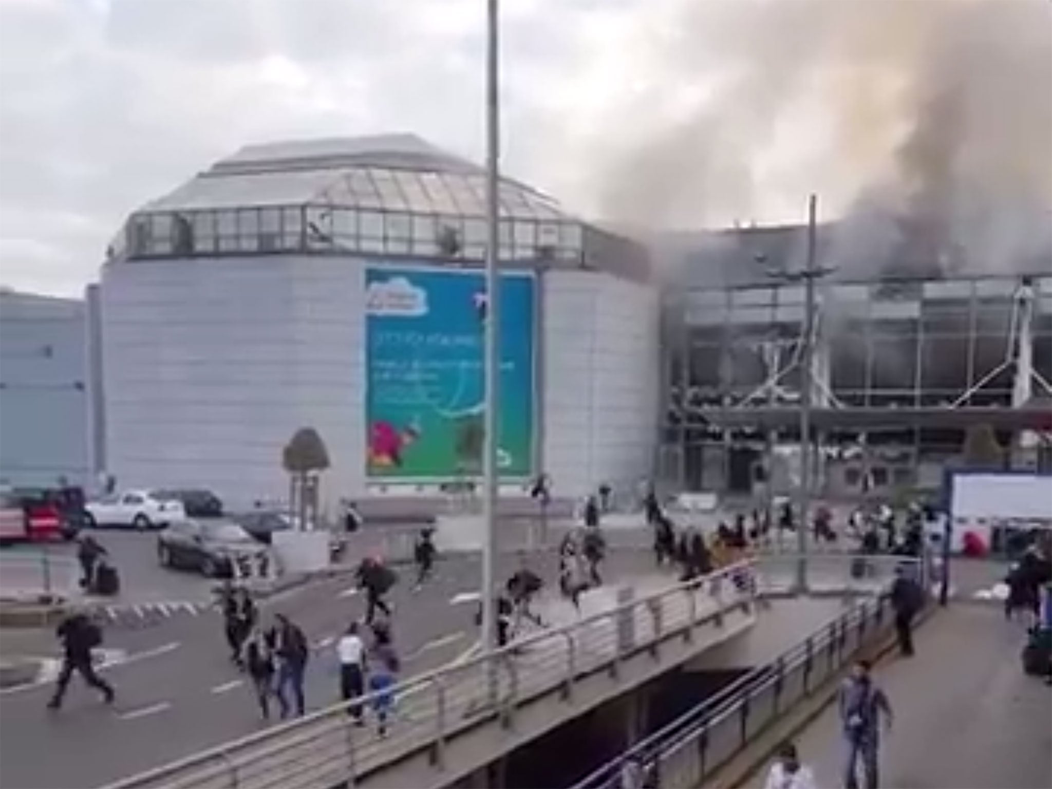 People are seen running from the terminal building