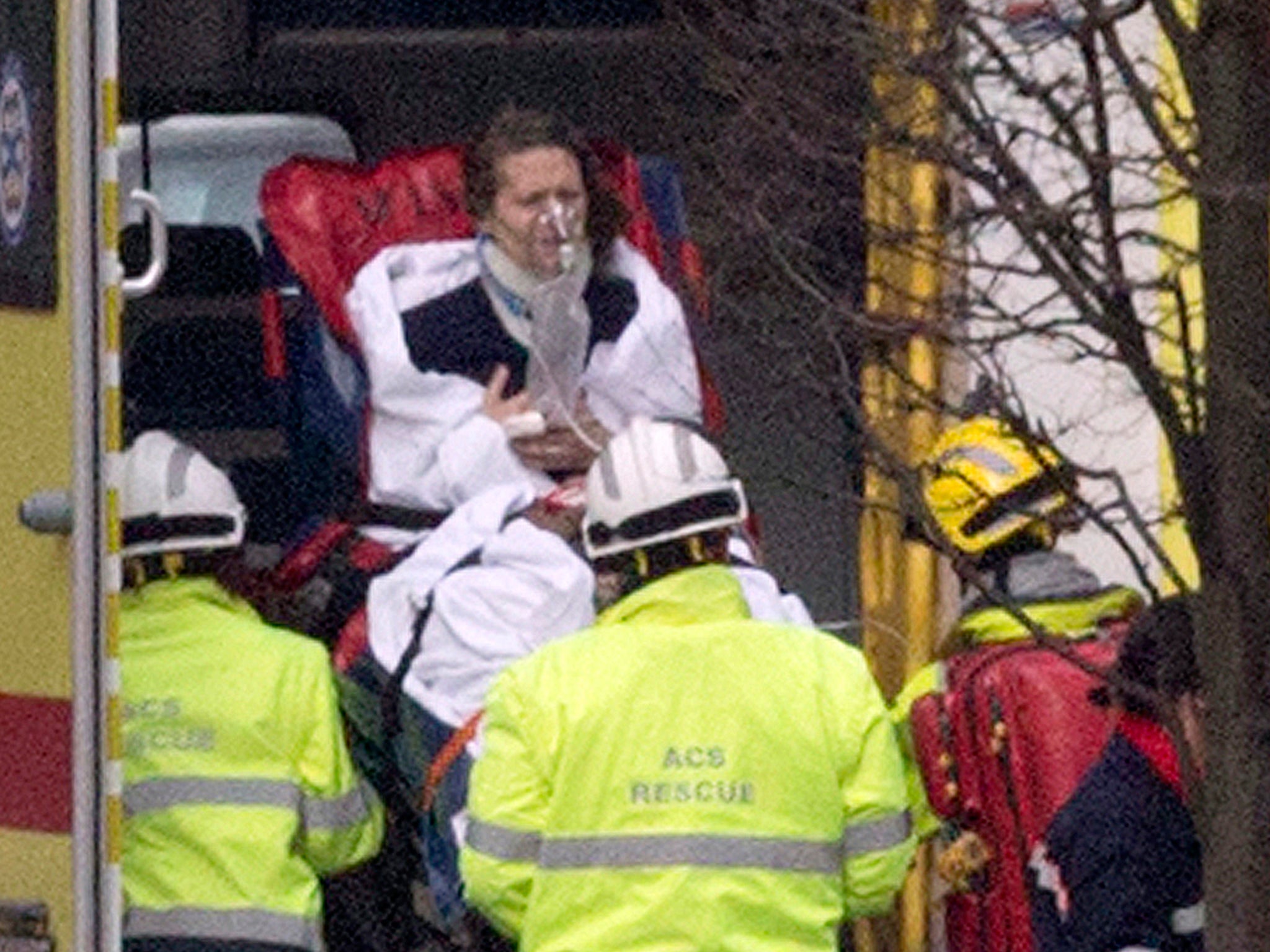 A woman is evacuated in an ambulance by emergency services after a explosion in a main metro station in Brussels