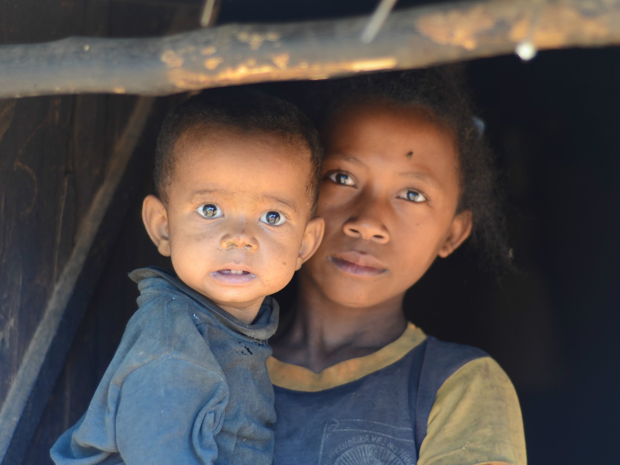 Julie dropped out of school a few years ago to care for her family when her mother became unwell. Her day begins at 5 am with a long, treacherous walk to the river for water; her younger siblings are frequently ill, and her father blames her when this happens.