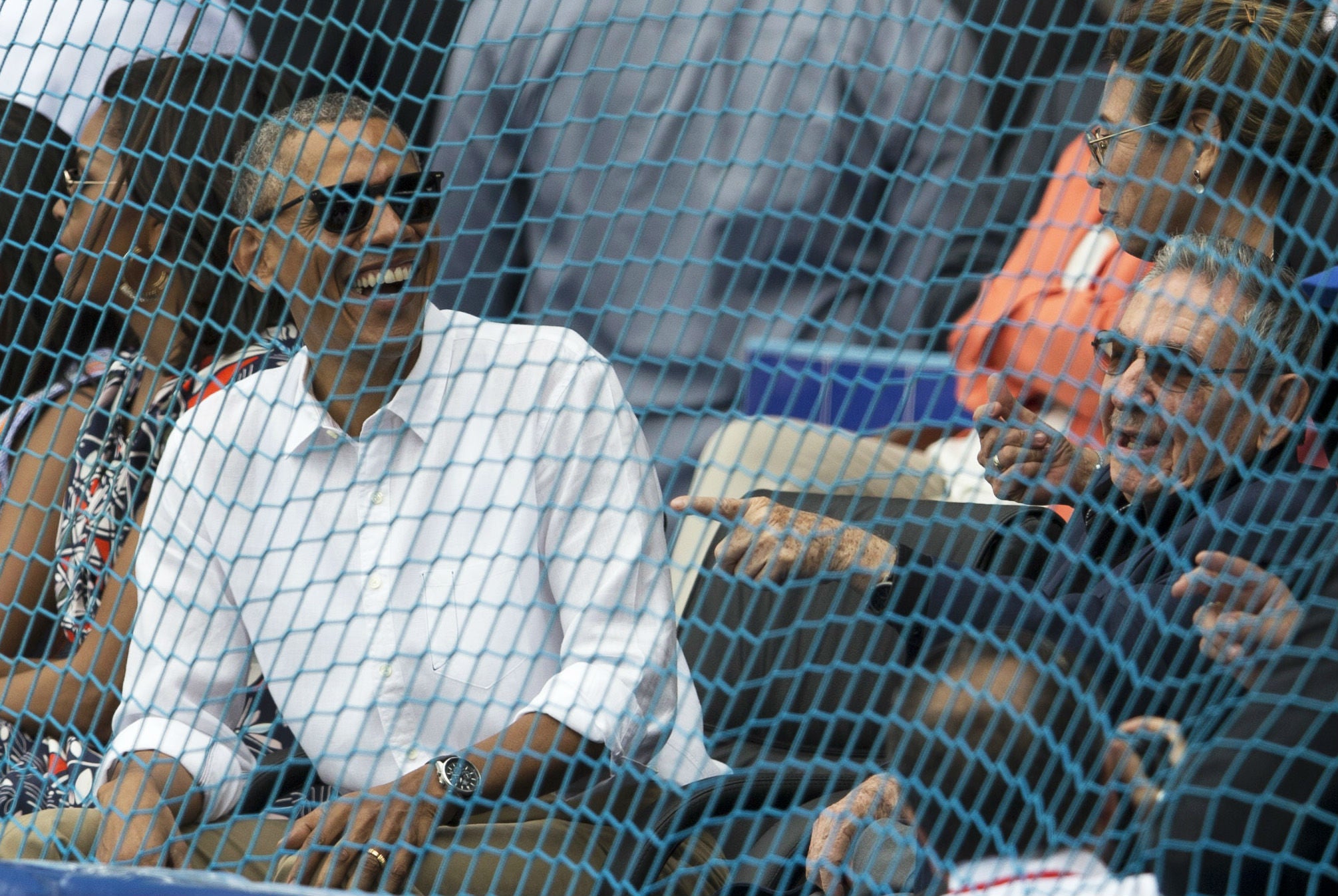 Mr Obama and Mr Castro joined the crowd for a minute's silence for those killed in Belgium