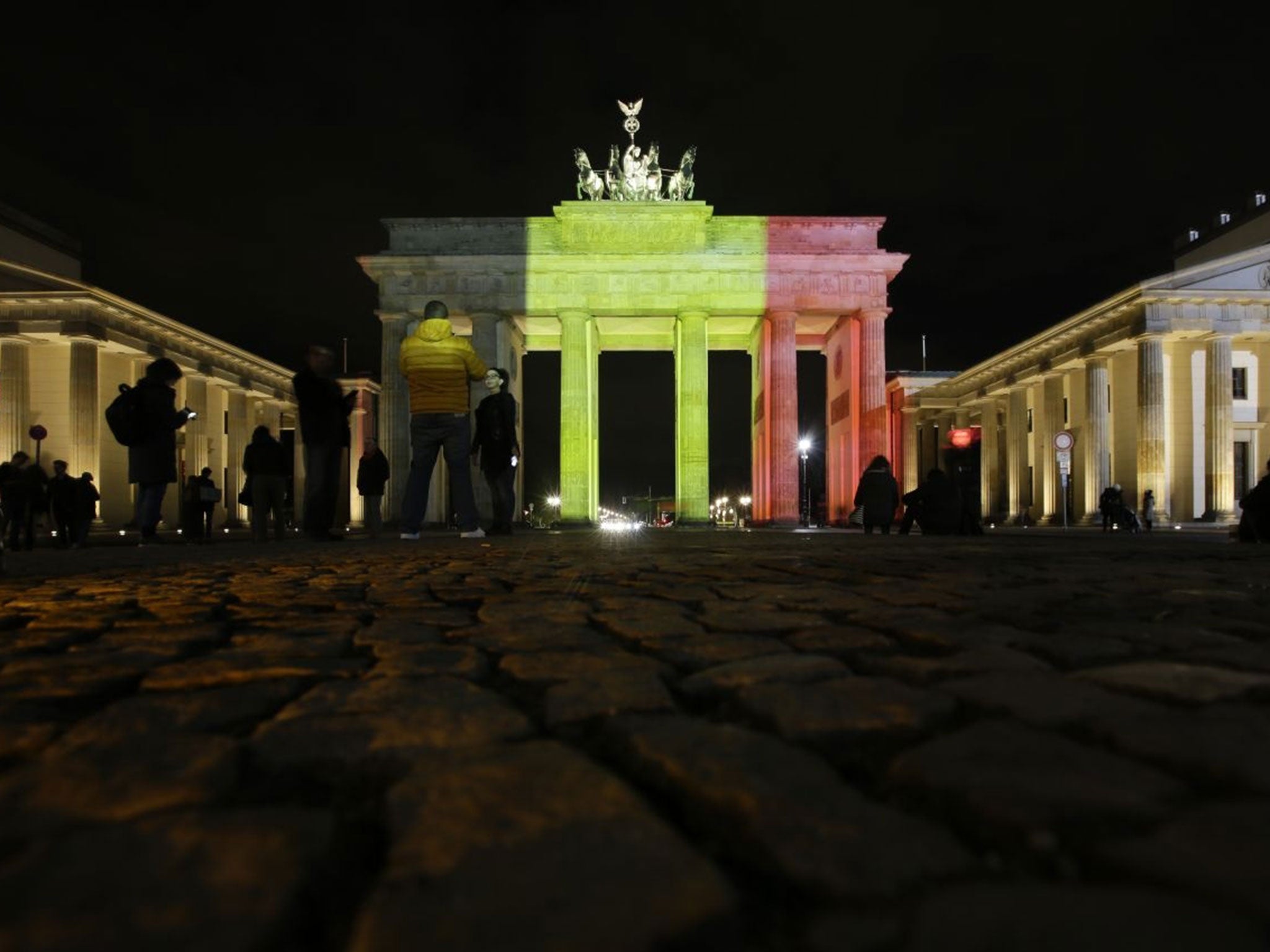 The Brandenburg Gate is illuminated with the Belgium national flag