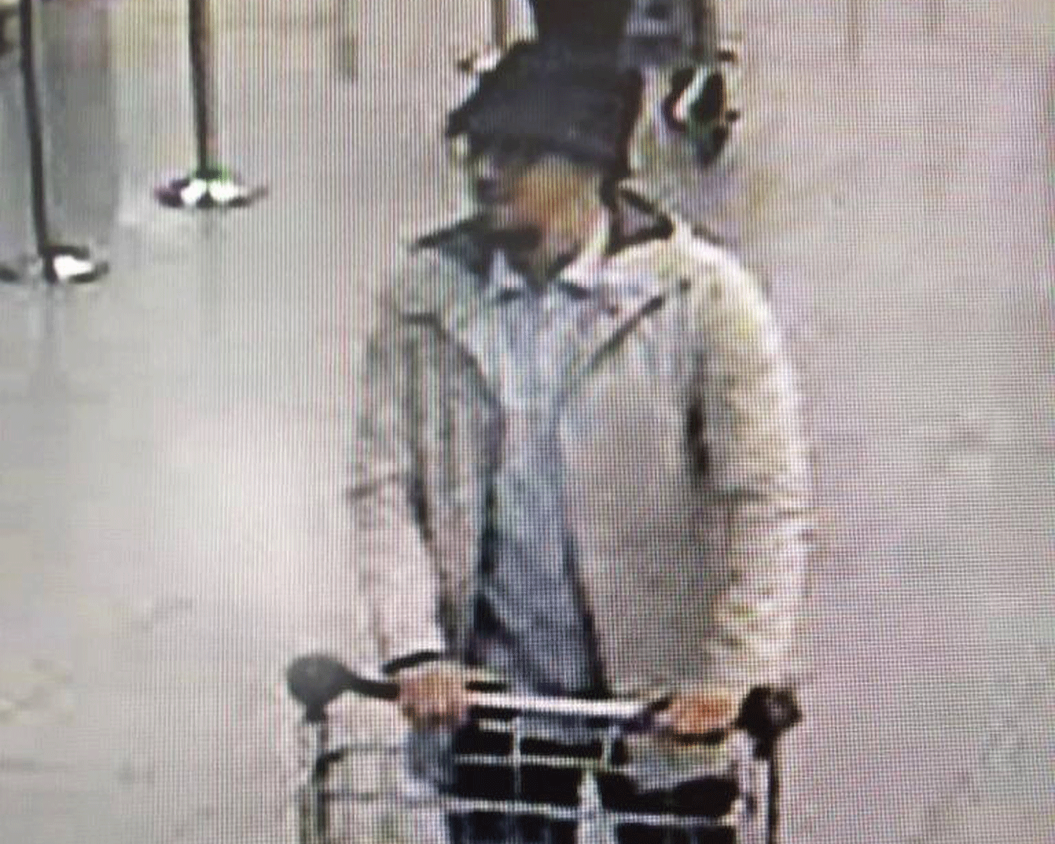 A third man pictured at Brussels Airport has not been identified