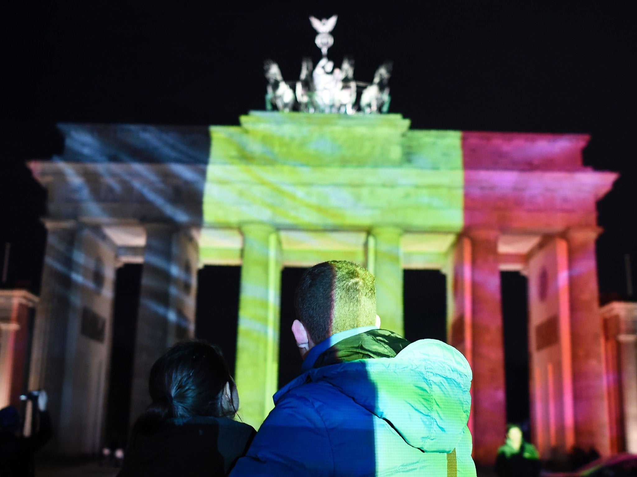 The Brandenburg Gate in Berlin joined other landmarks around the world in lighting up in the colours of the Belgium flag last night