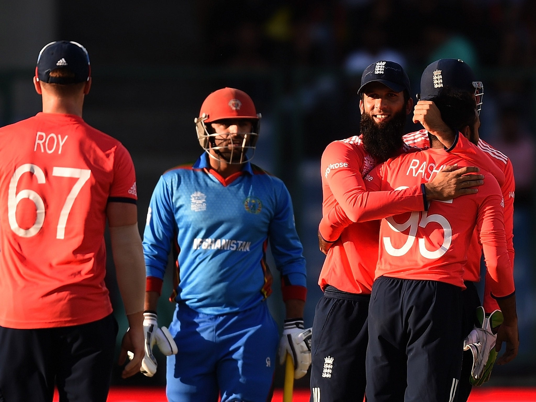 England celebrate after claiming a 15-run victory over Afghanistan