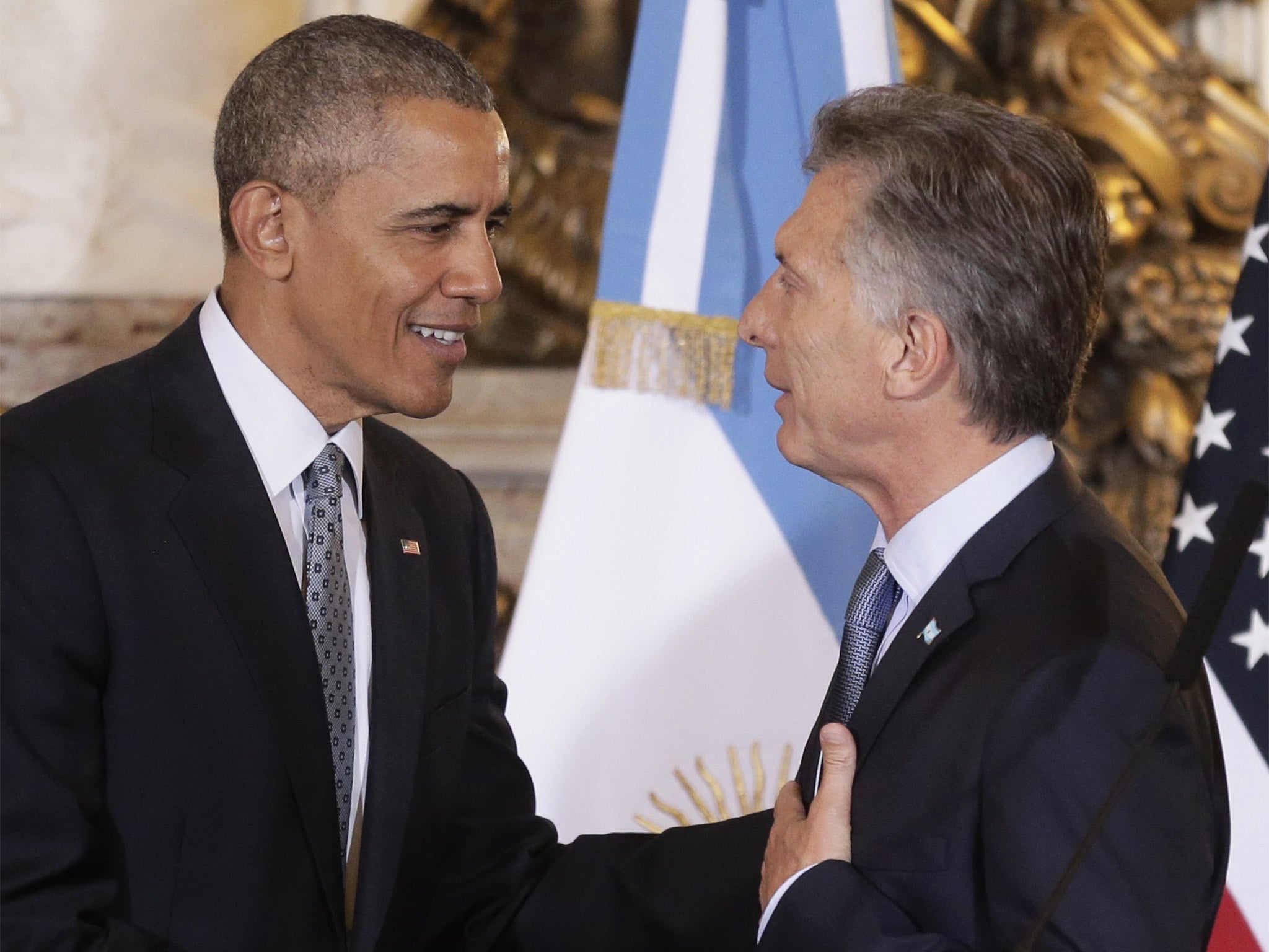 President Barack Obama talks with his Argentine counterpart, Mauricio Macri, at the end of a joint news conference at the Casa Rosada Presidential Palace in Buenos Aires