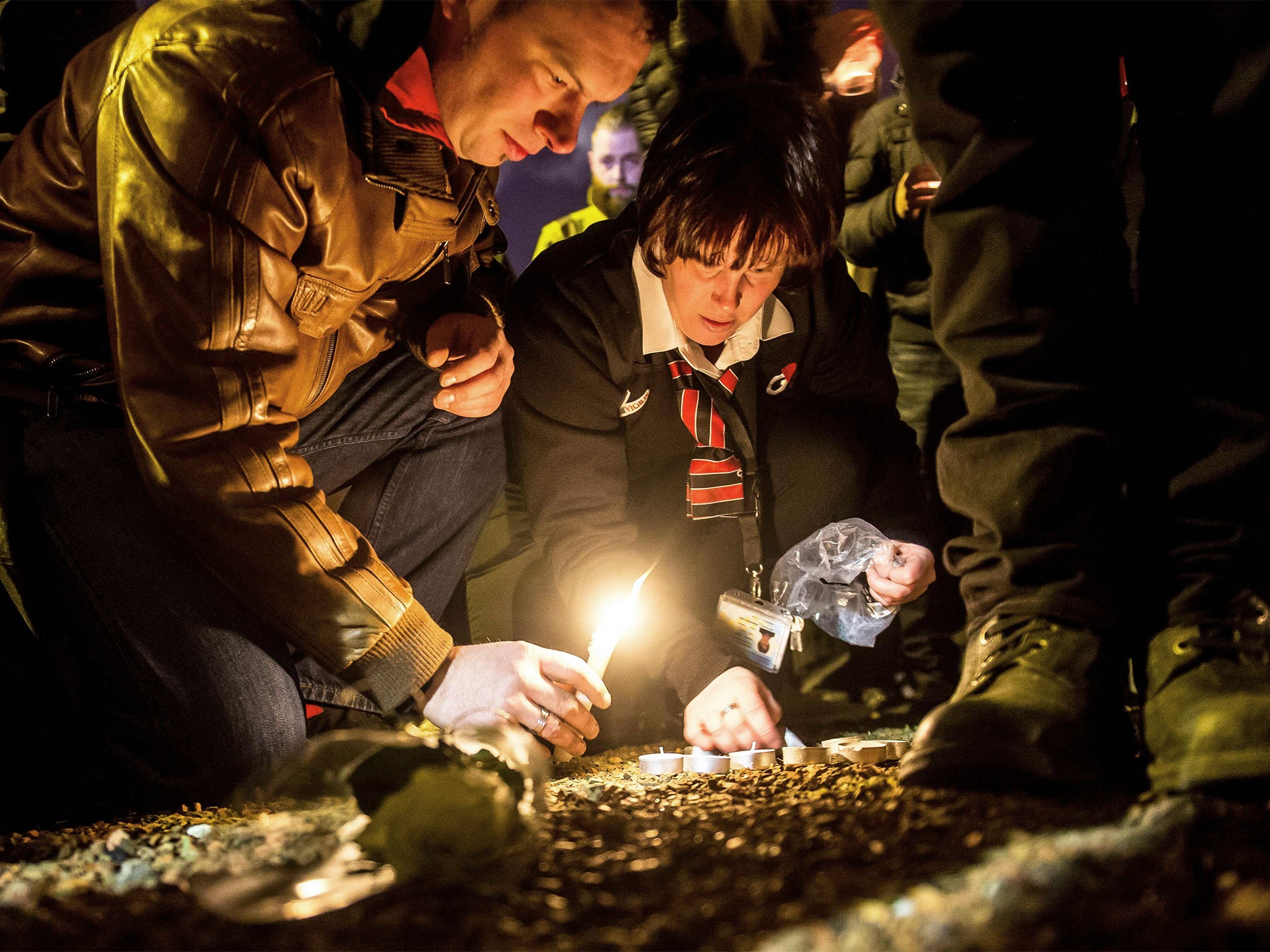 Brussels airport workers pay tribute to the victims near Zaventem