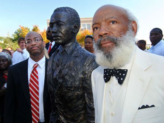 Mr Meredith and his statue at a ceremony ten years ago