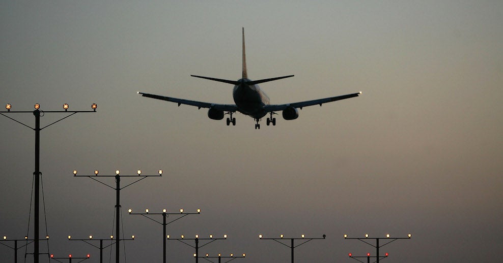 A plane touches down at LAX.