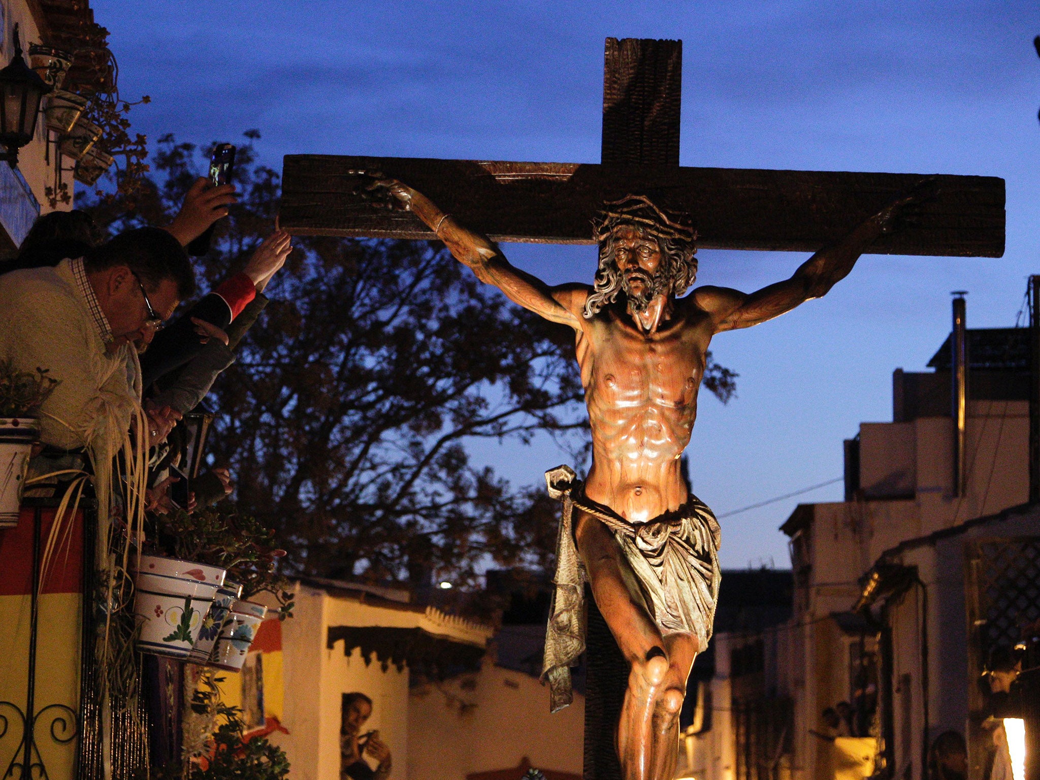 An Easter procession featuring Jesus on a cross in Spain in 2015