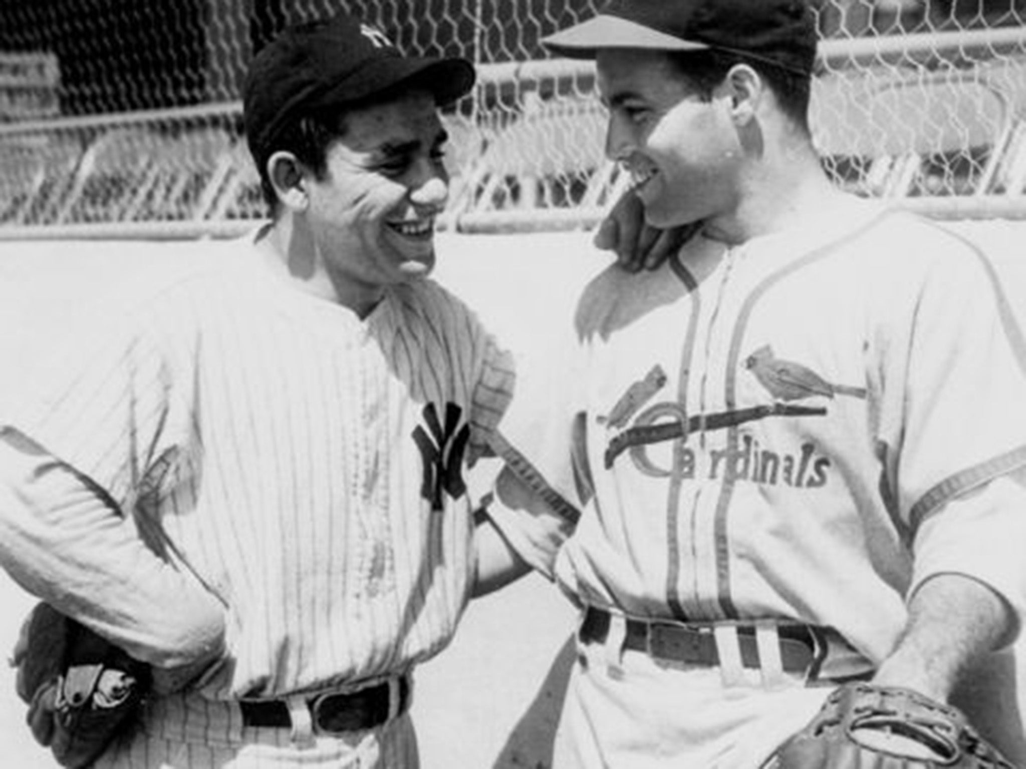 Yogi Berra (left) chats with Joe Garagiola at Yankee Stadium in 1947