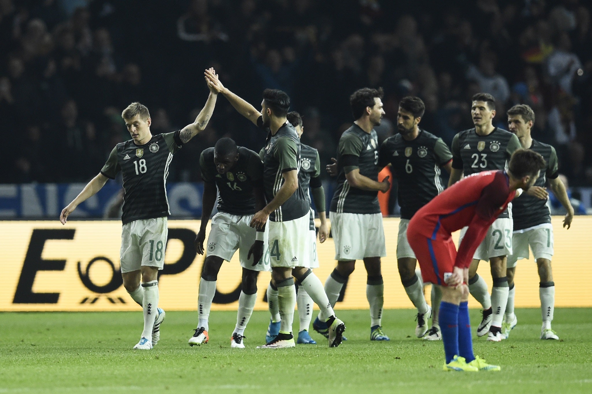 Toni Kroos celebrates with his Germany team-mates after scoring against England