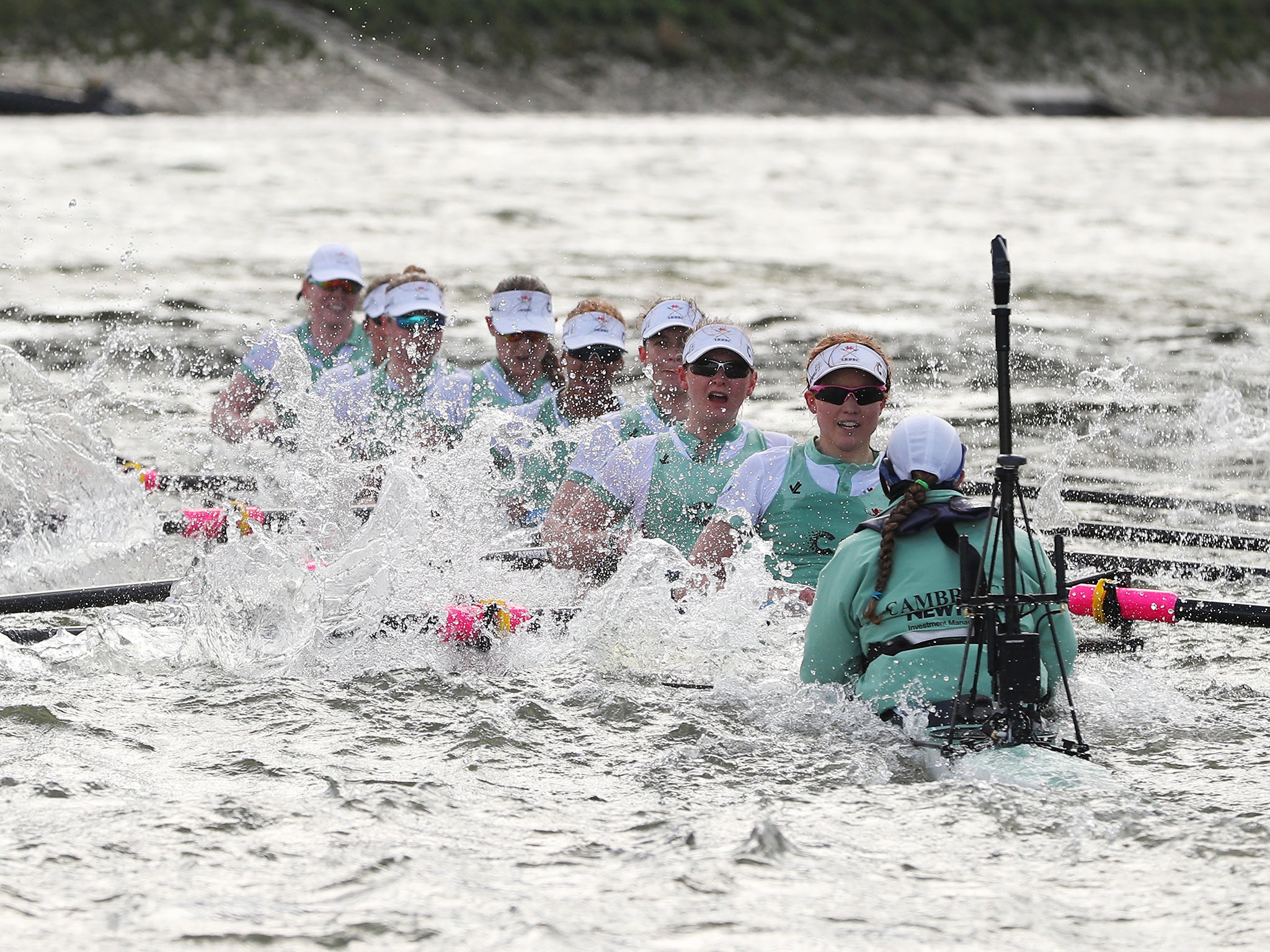 The Cambridge boat takes on water in the rough conditions during The Cancer Research UK Women's Boat Race