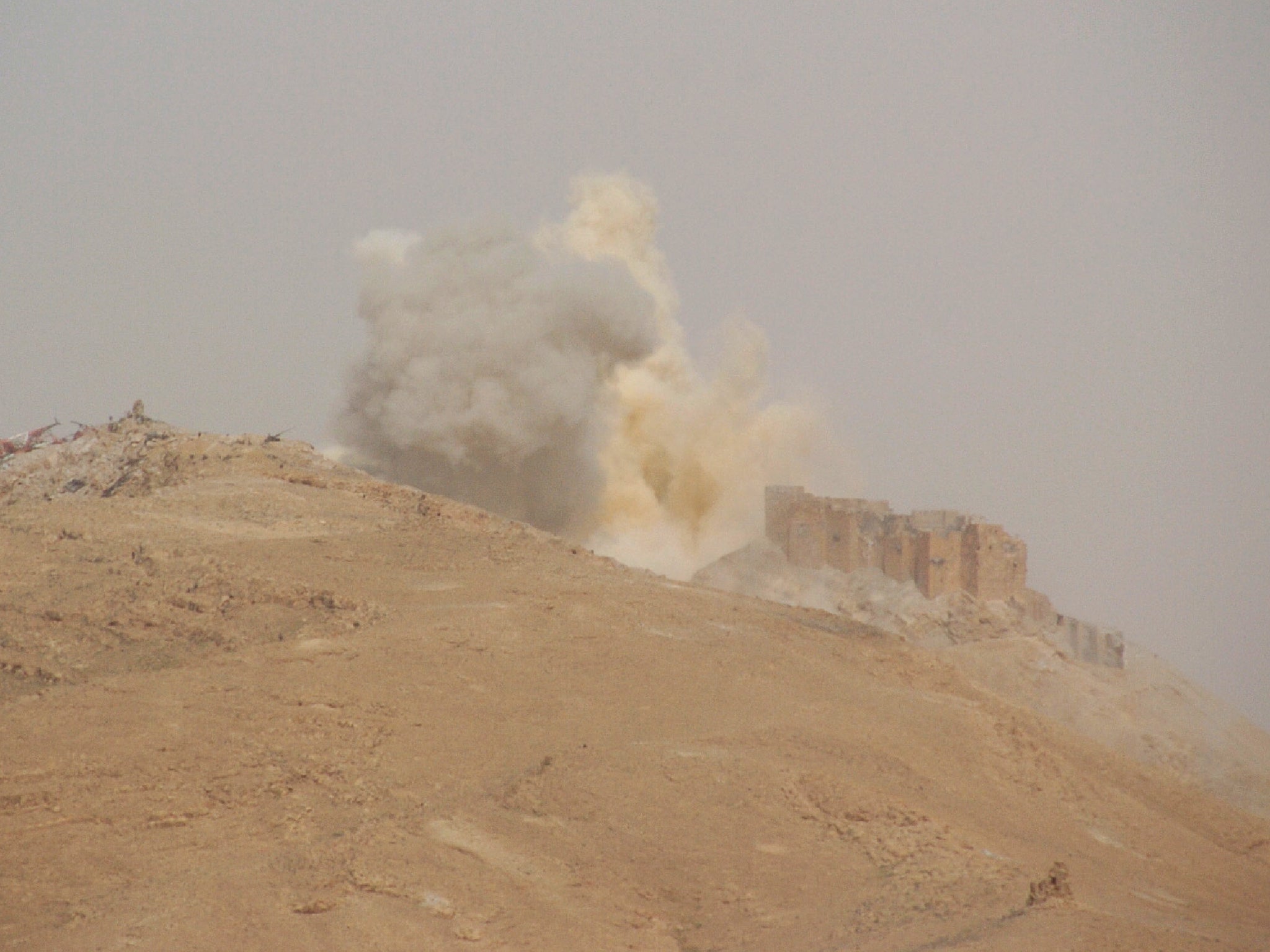 Smoke billows from the Palmyra citadel as Syrian government forces backed by Russian air strikes took back the city from Islamic State