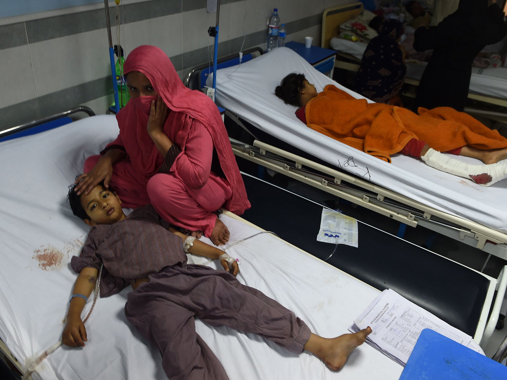 An injured Pakistani child victim of a suicide blast rests in a hospital in Lahore