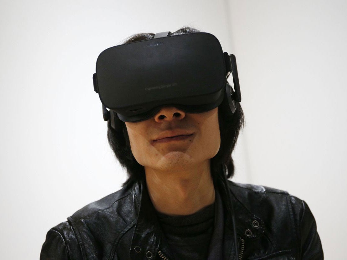 A man uses the Oculus Rift at CES 2016 in Las Vegas