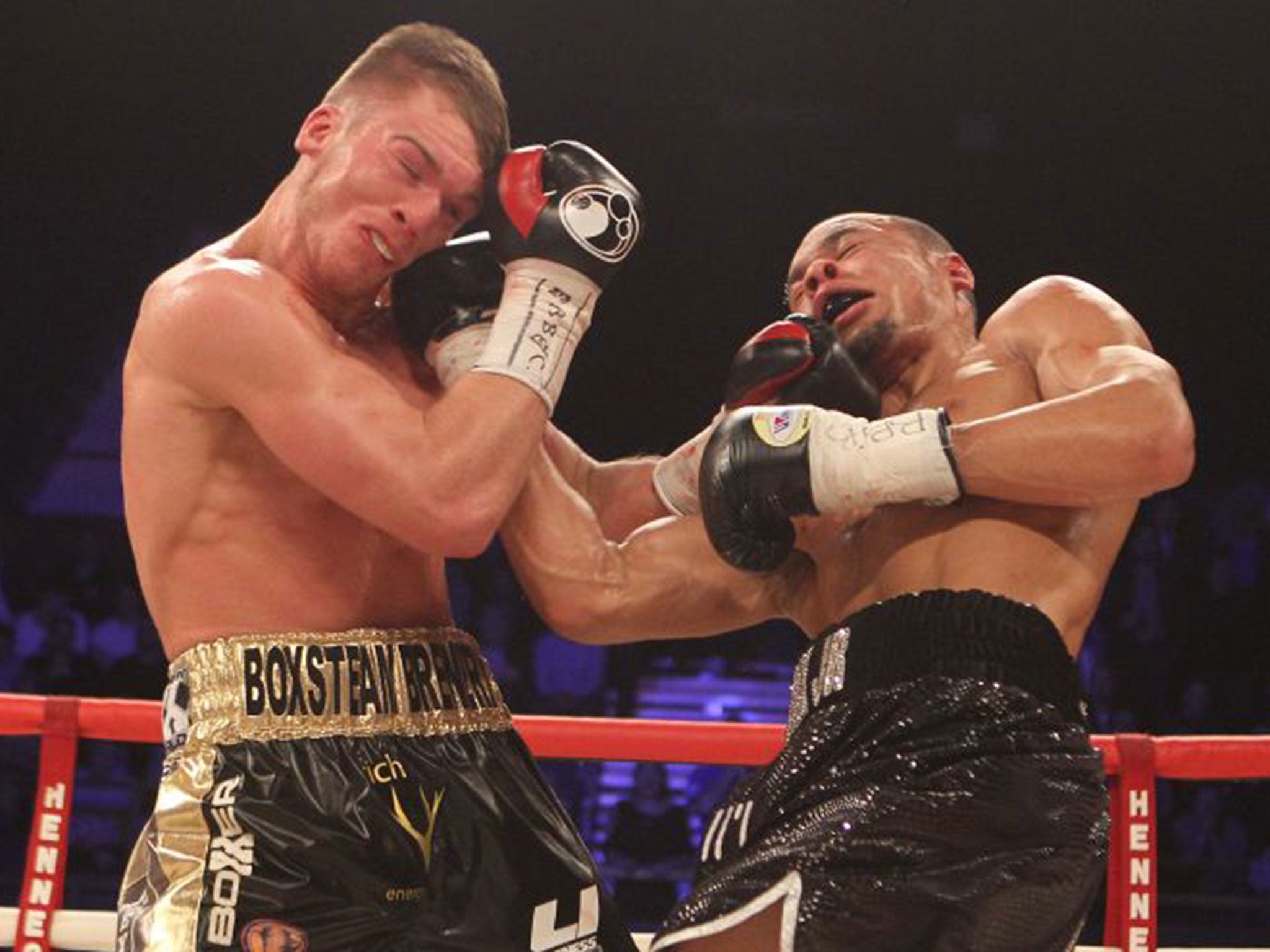 Nick Blackwell, left, and Chris Eubank Jnr exchange blows during their title fight