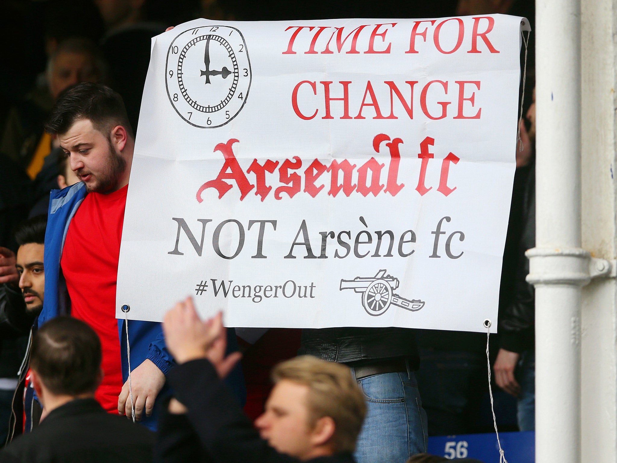 A fan's banner is displayed protesting against Arsene Wenger (Getty)