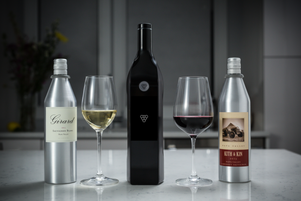 The Kuvée bottle (centre) with its metal wine inserts on either side