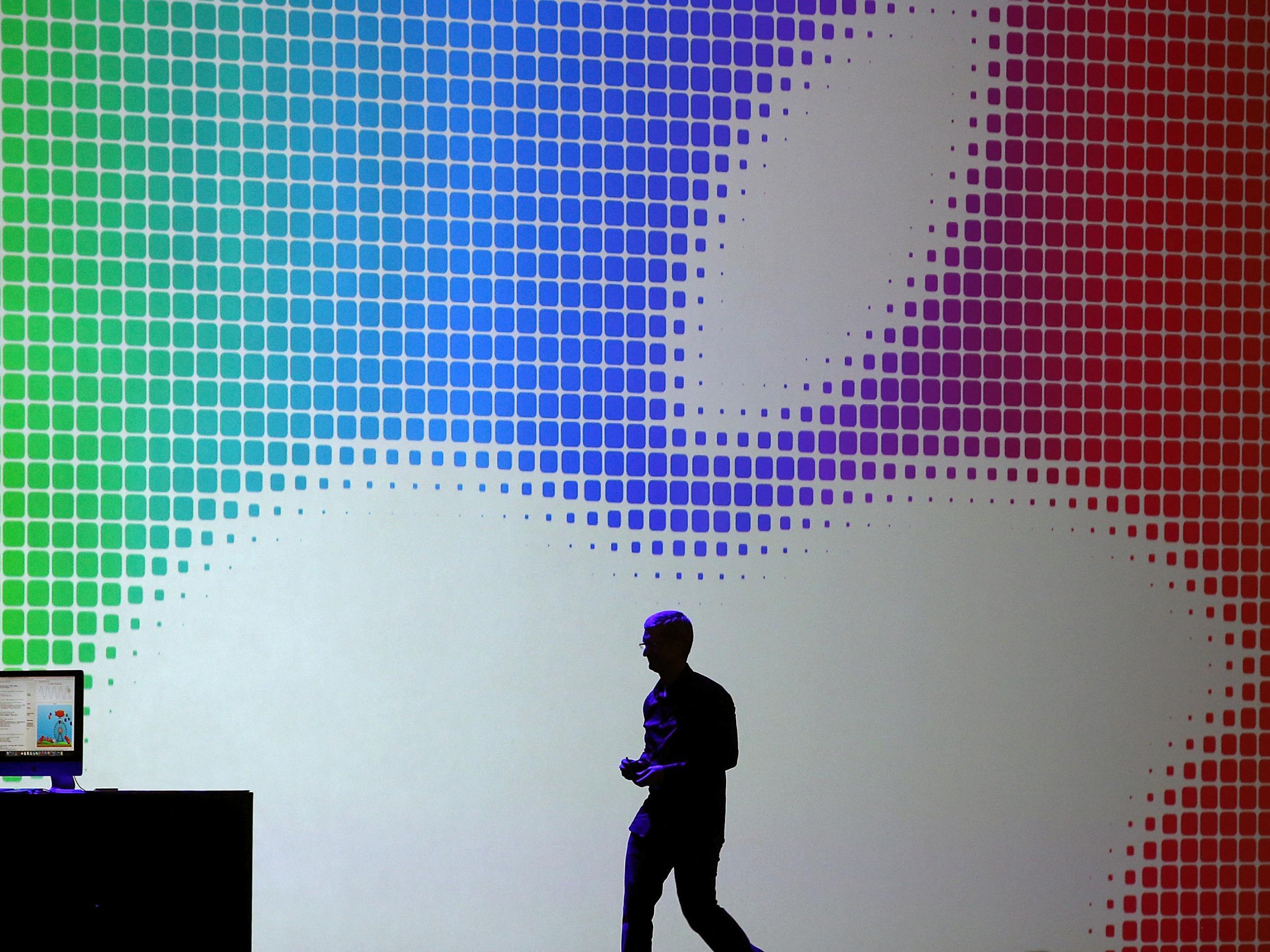 Tim Cook walks off stage after speaking during the Apple Worldwide Developers Conference at the Moscone West center on June 2, 2014 in San Francisco, California