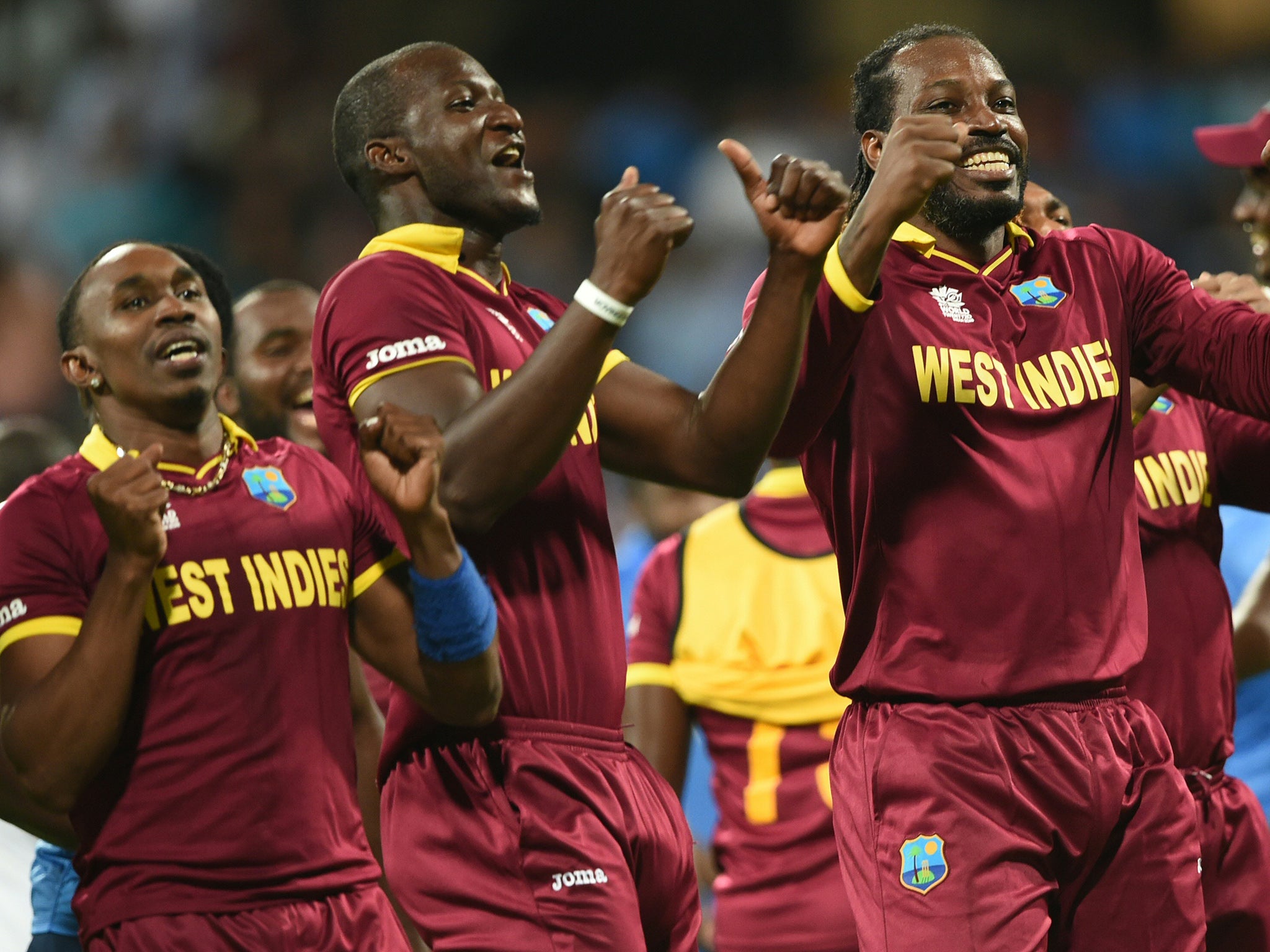 &#13;
West Indies's Darren Sammy, Dwayne Bravo and Chris Gayle celebrate &#13;