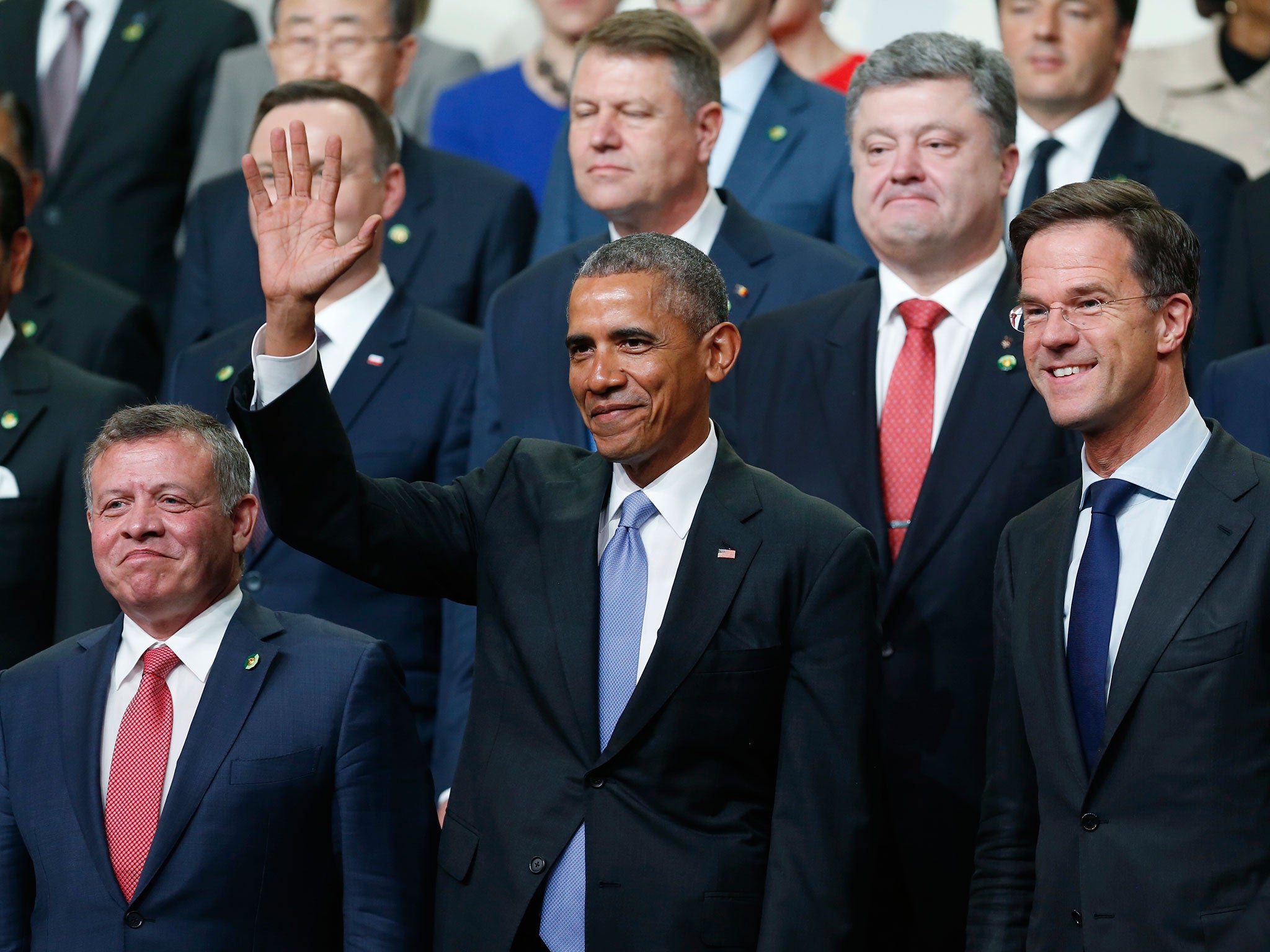 President Barack Obama waves as world leaders gather for a 'team photo' during a nuclear summit in Washington, DC, on 1 April, 2016