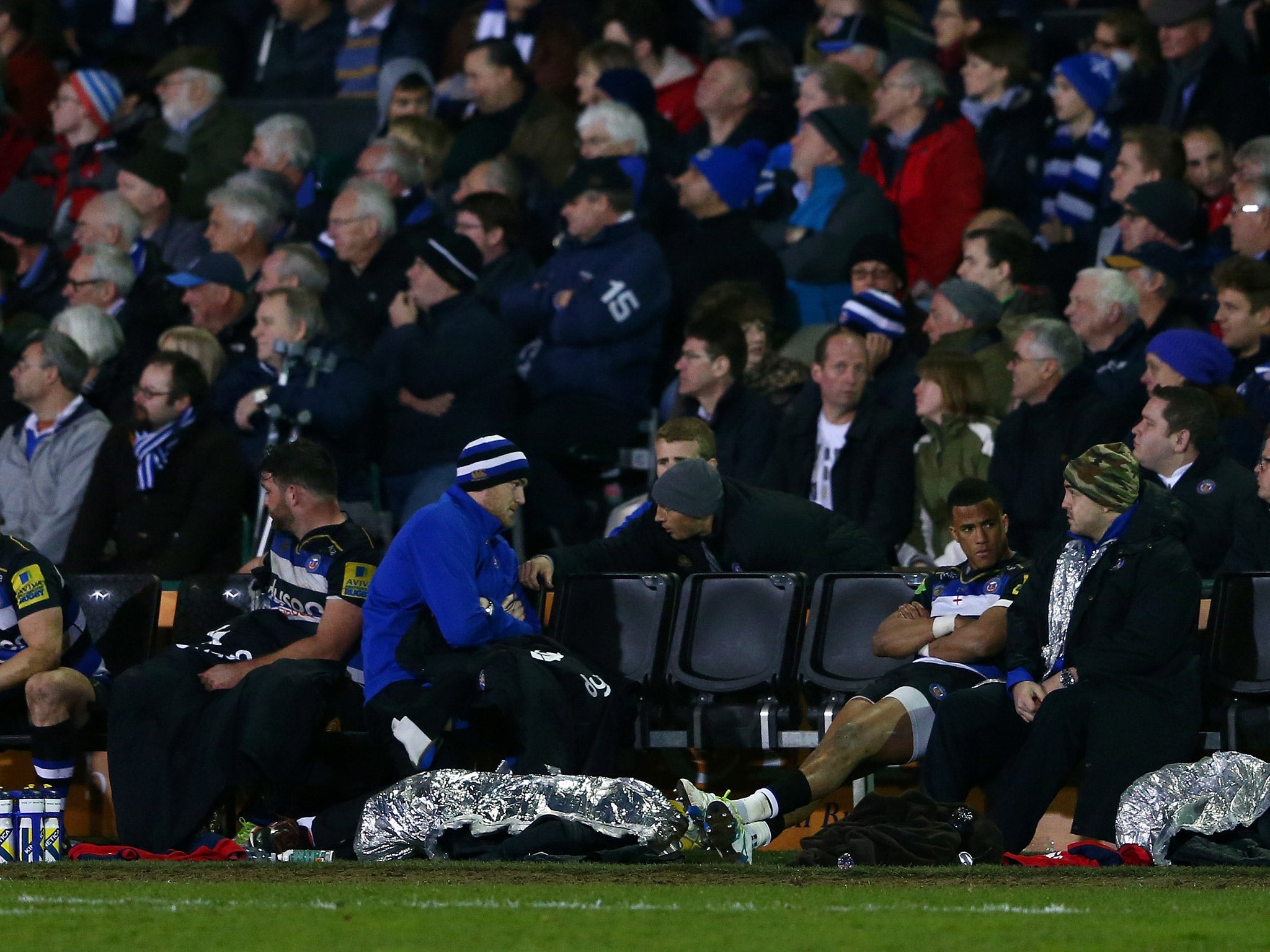 Anthony Watson sits on the sidelines after being sent off in Bath's defeat by Saracens