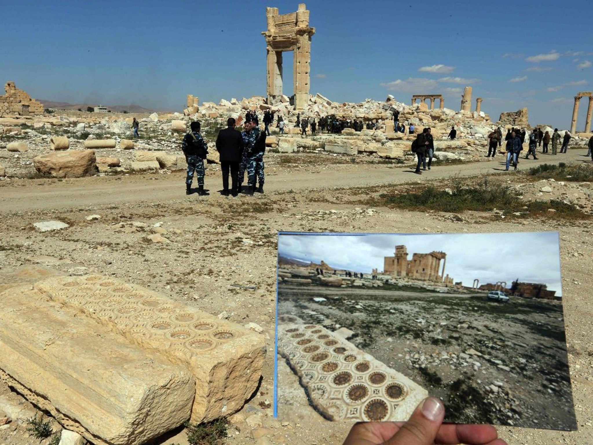 Security officials stand around the ruins of the Temple of Bel. (JOSEPH EID/AFP/Getty Images )