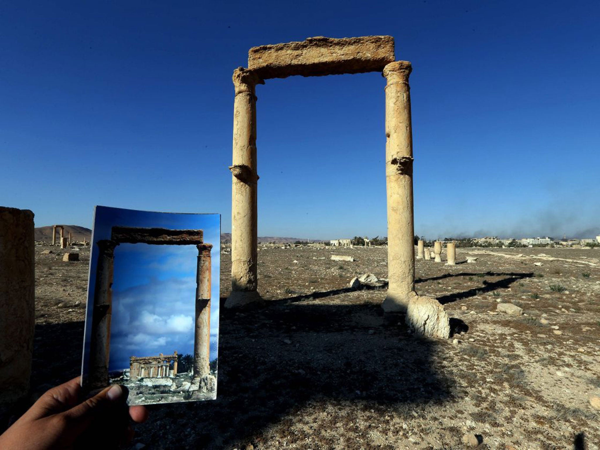 The Temple of Baal Shamin seen through two Corinthian columns at Palmyra, Syria. (JOSEPH EID/AFP/Getty Images )