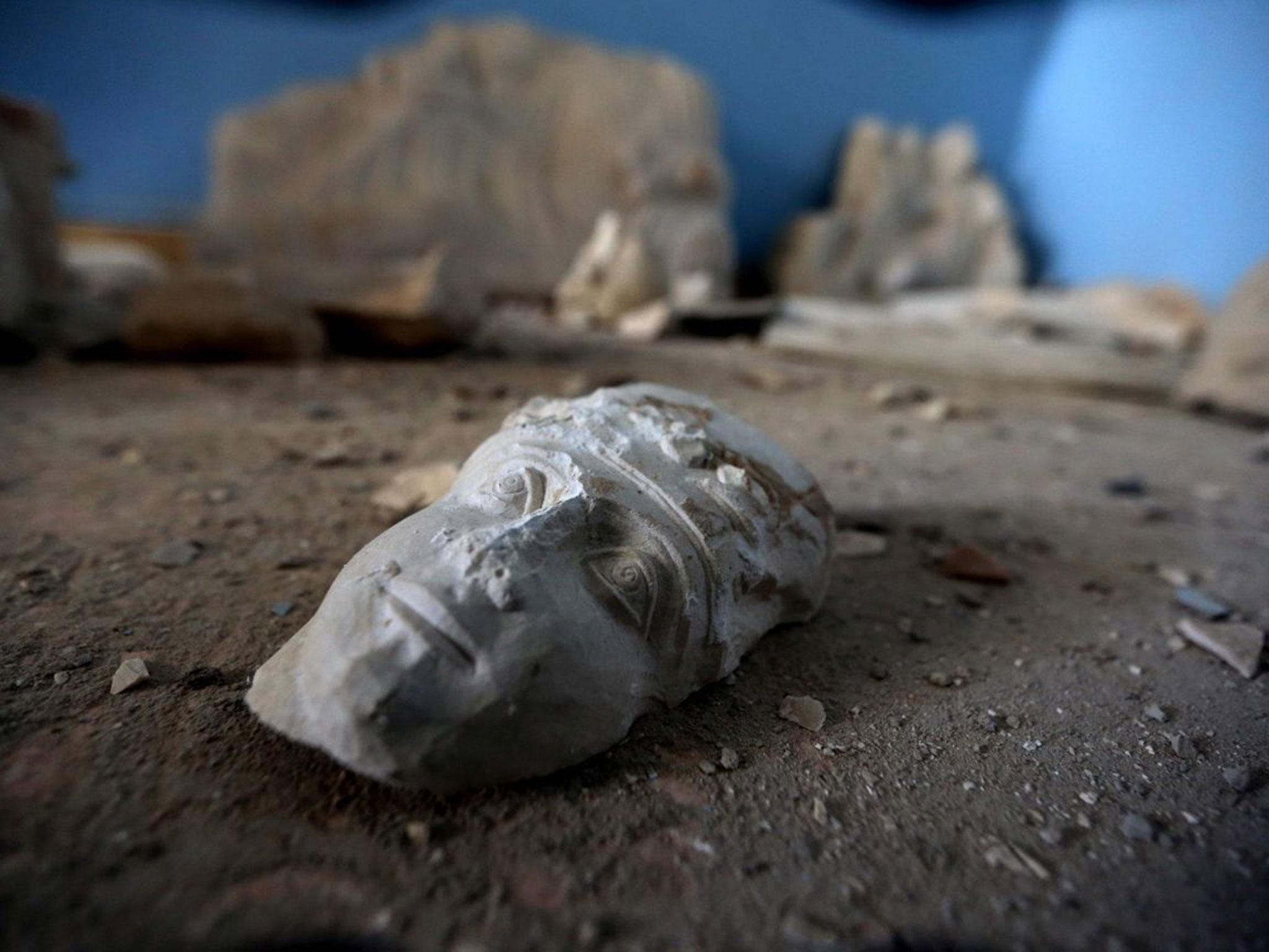 The face of a statue lies on the floor in the Palmyra museum. (JOSEPH EID/AFP/Getty Images )