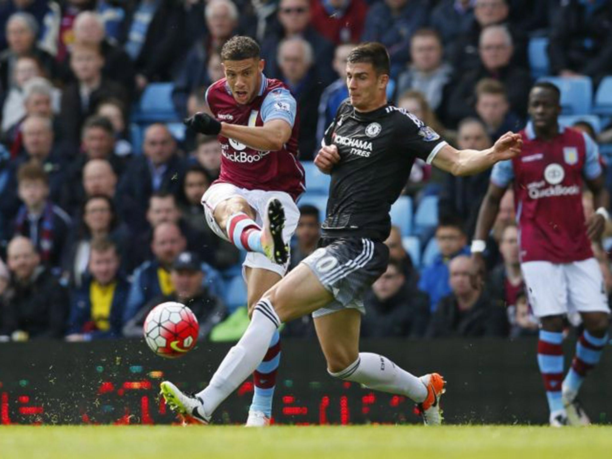 Rudy Gestede shoots past Matt Miazga during Aston Villa's clash with Chelsea