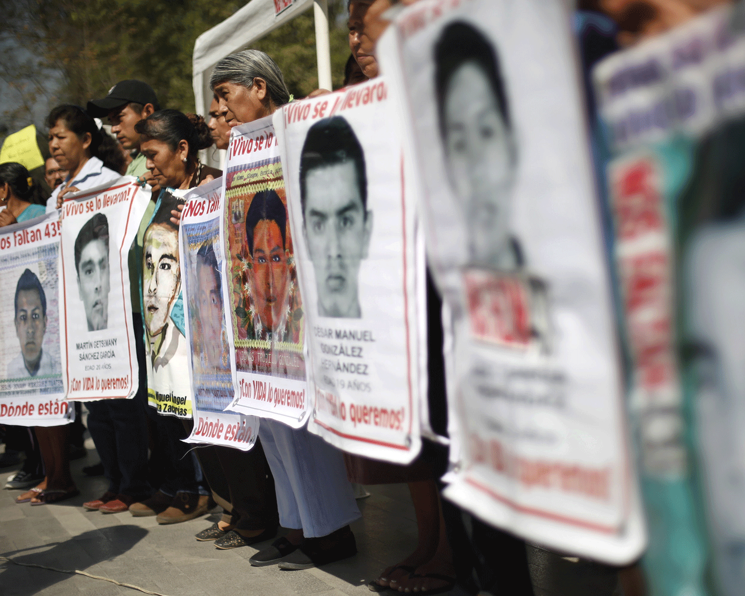 Relatives of the missing students from Ayotzinapa College Raul Isidro Burgos take part in a demonstration